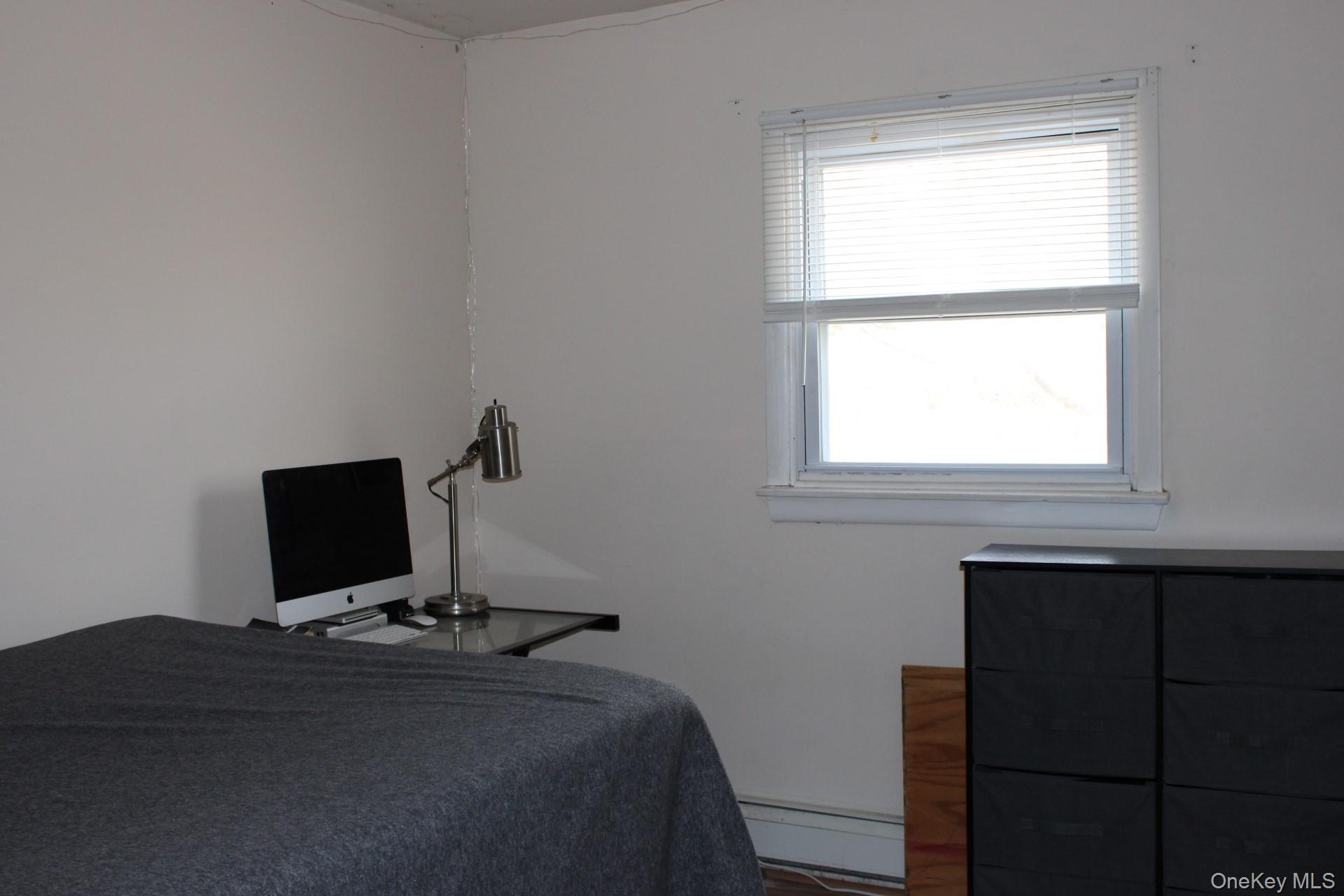 Bedroom with baseboard heating