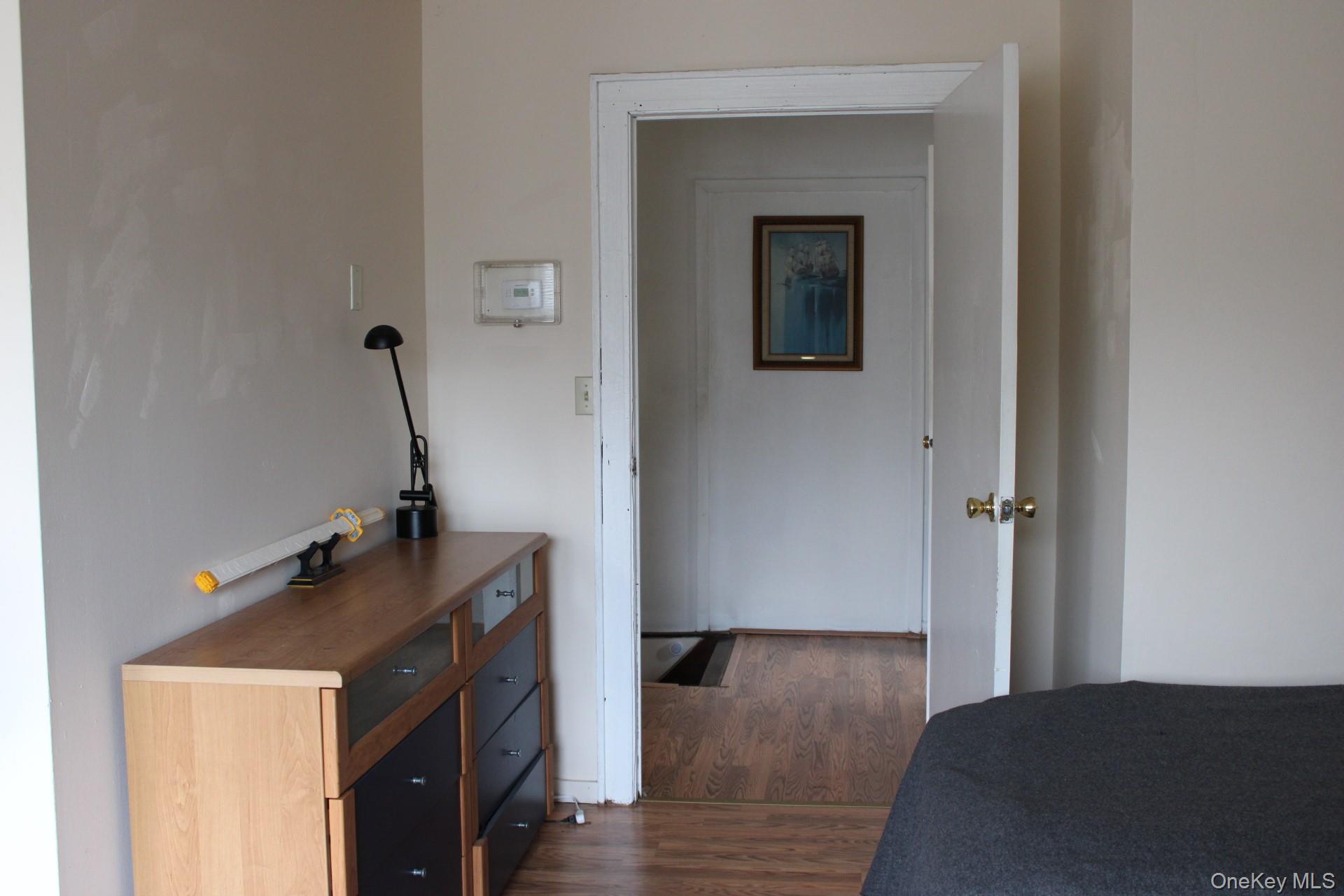Bedroom featuring dark wood-style floors