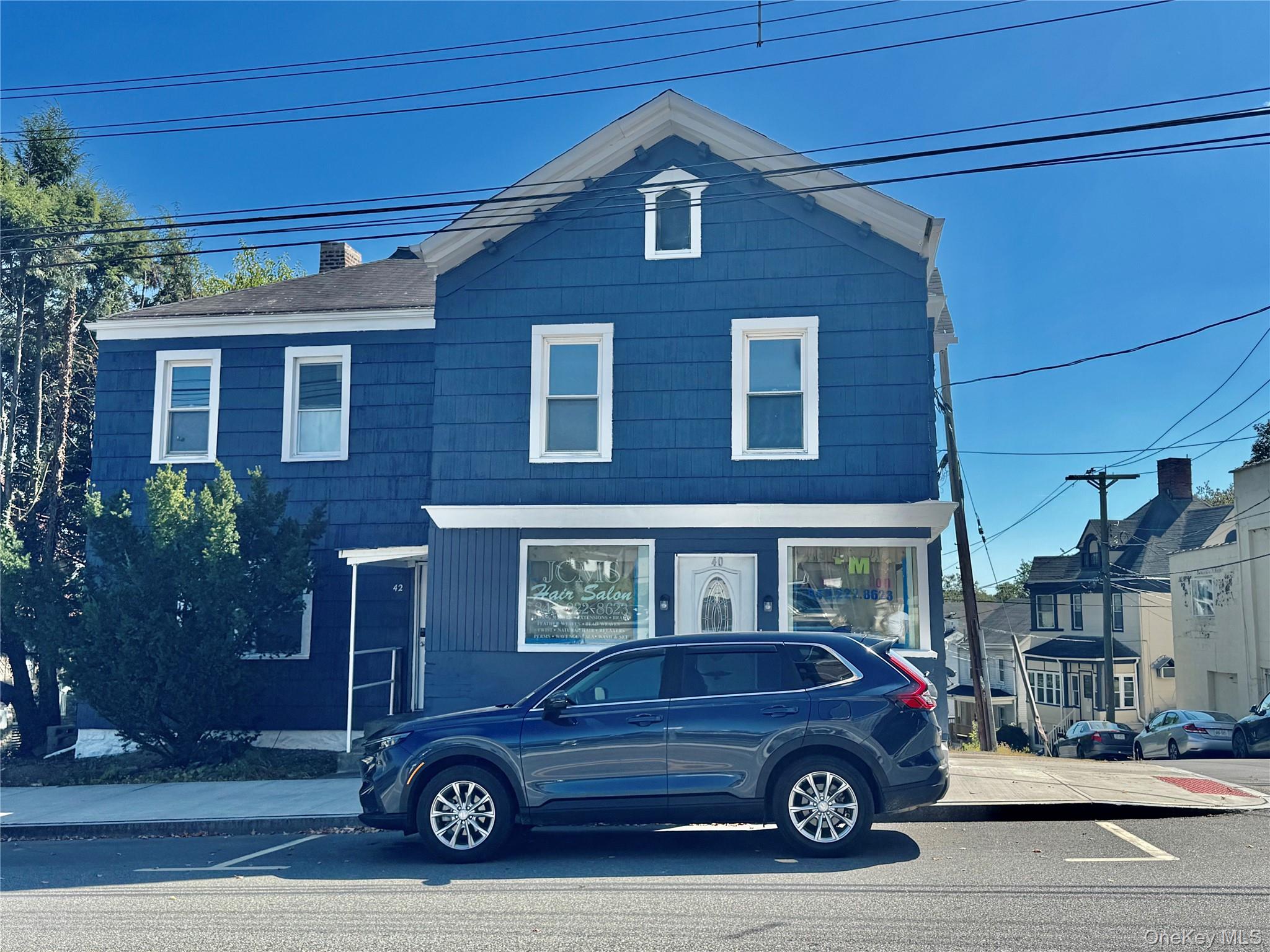 Traditional-style home featuring a chimney