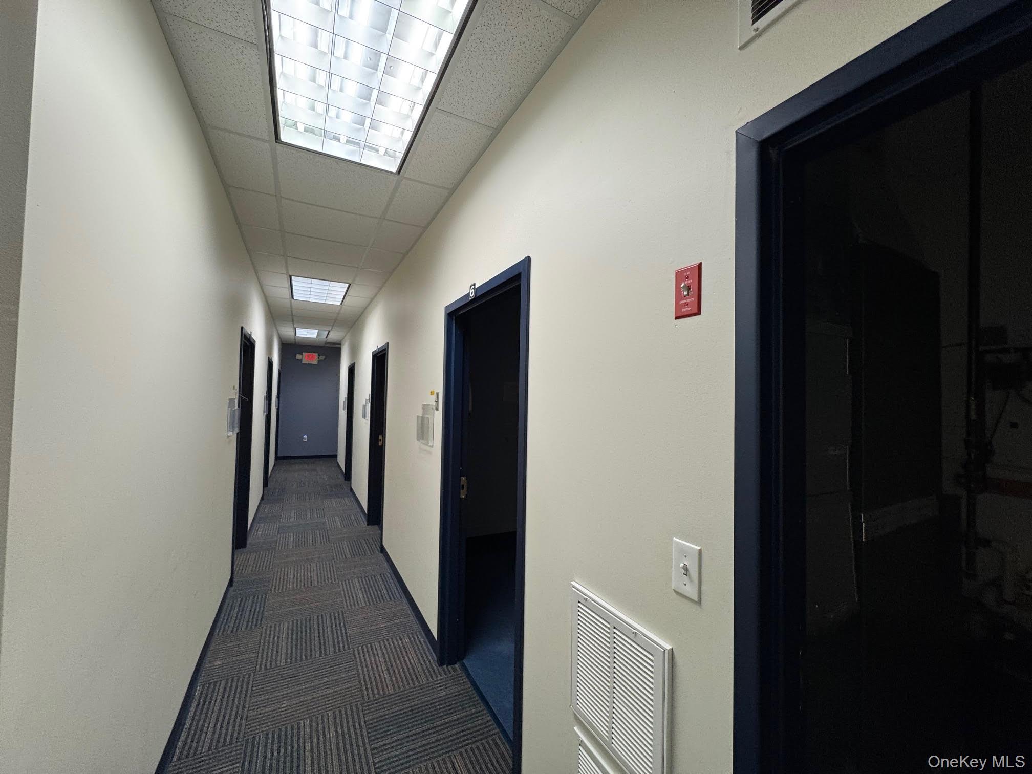 Corridor with dark carpet