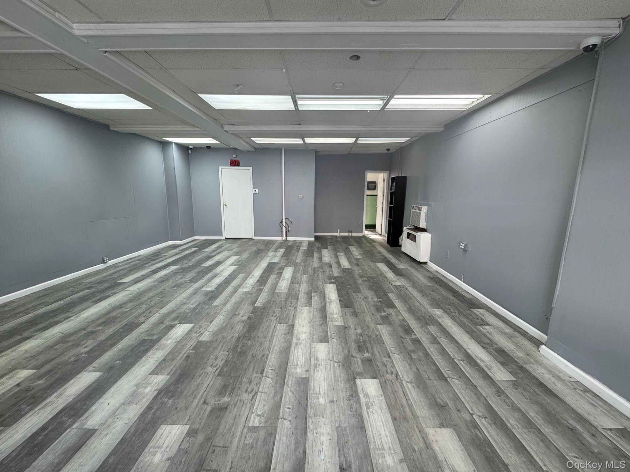 Unfurnished room featuring wood finished floors