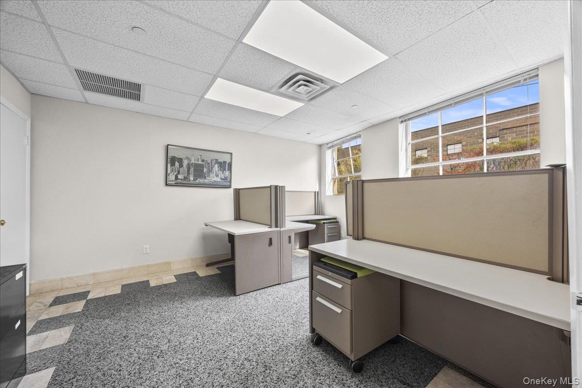 Unfurnished office featuring a paneled ceiling