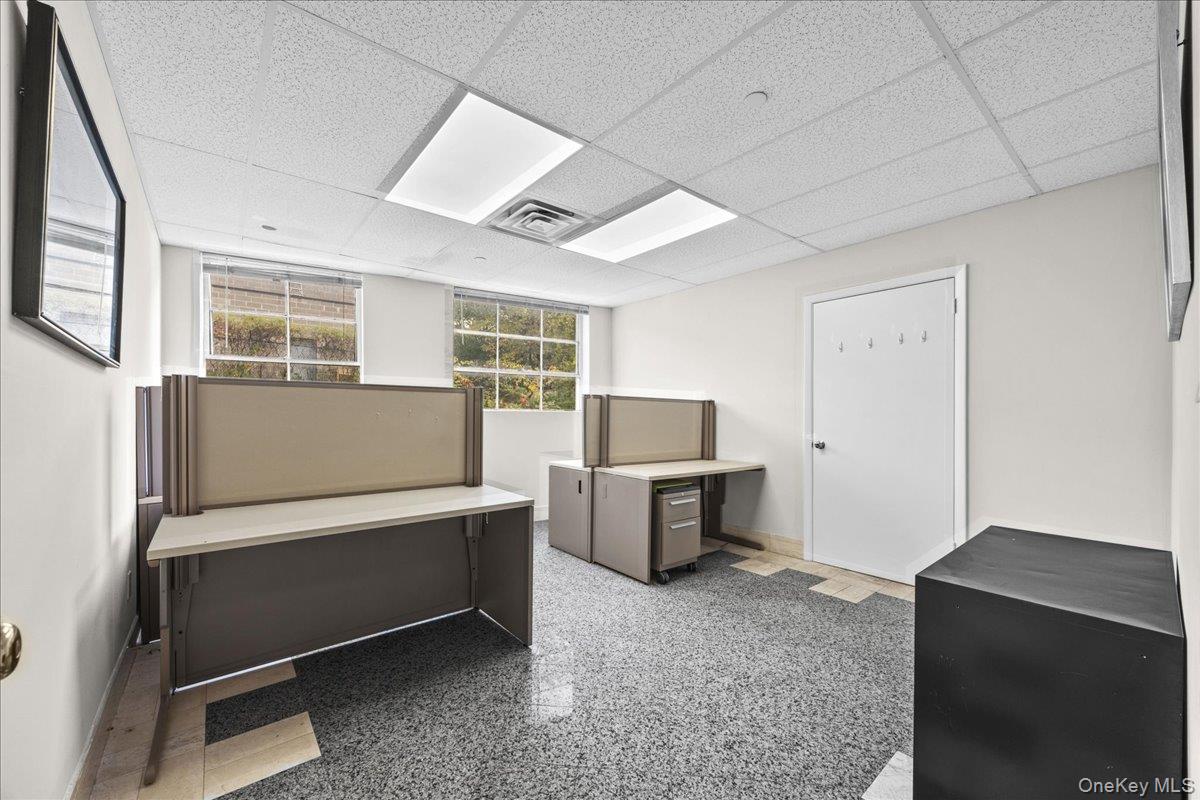 Unfurnished office with a drop ceiling