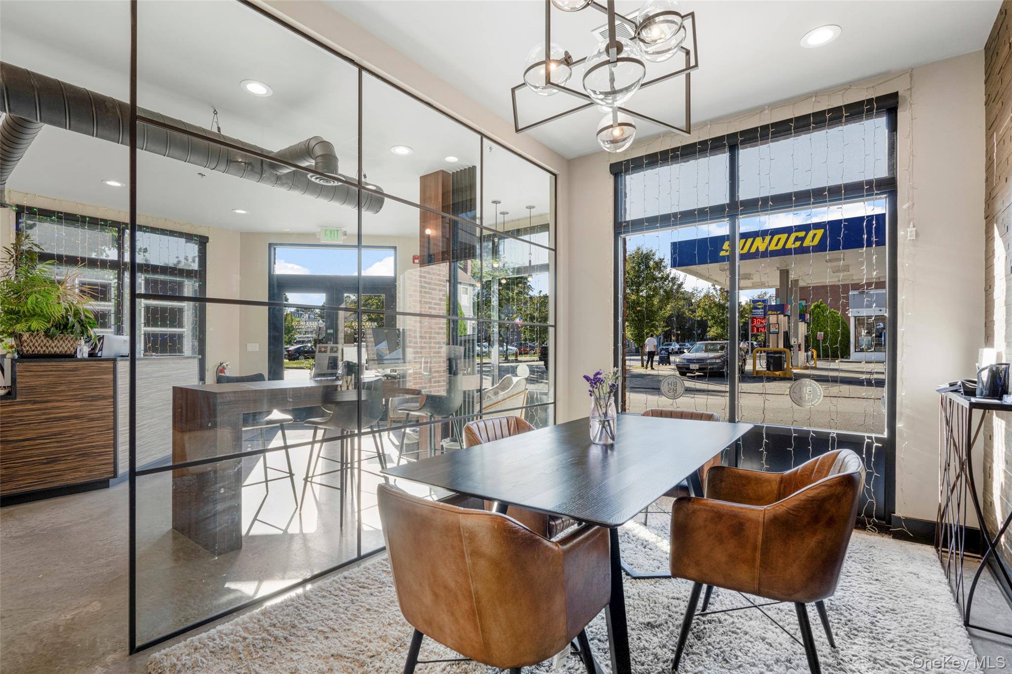 Dining room featuring expansive windows, healthy amount of natural light, a chandelier, and recessed lighting