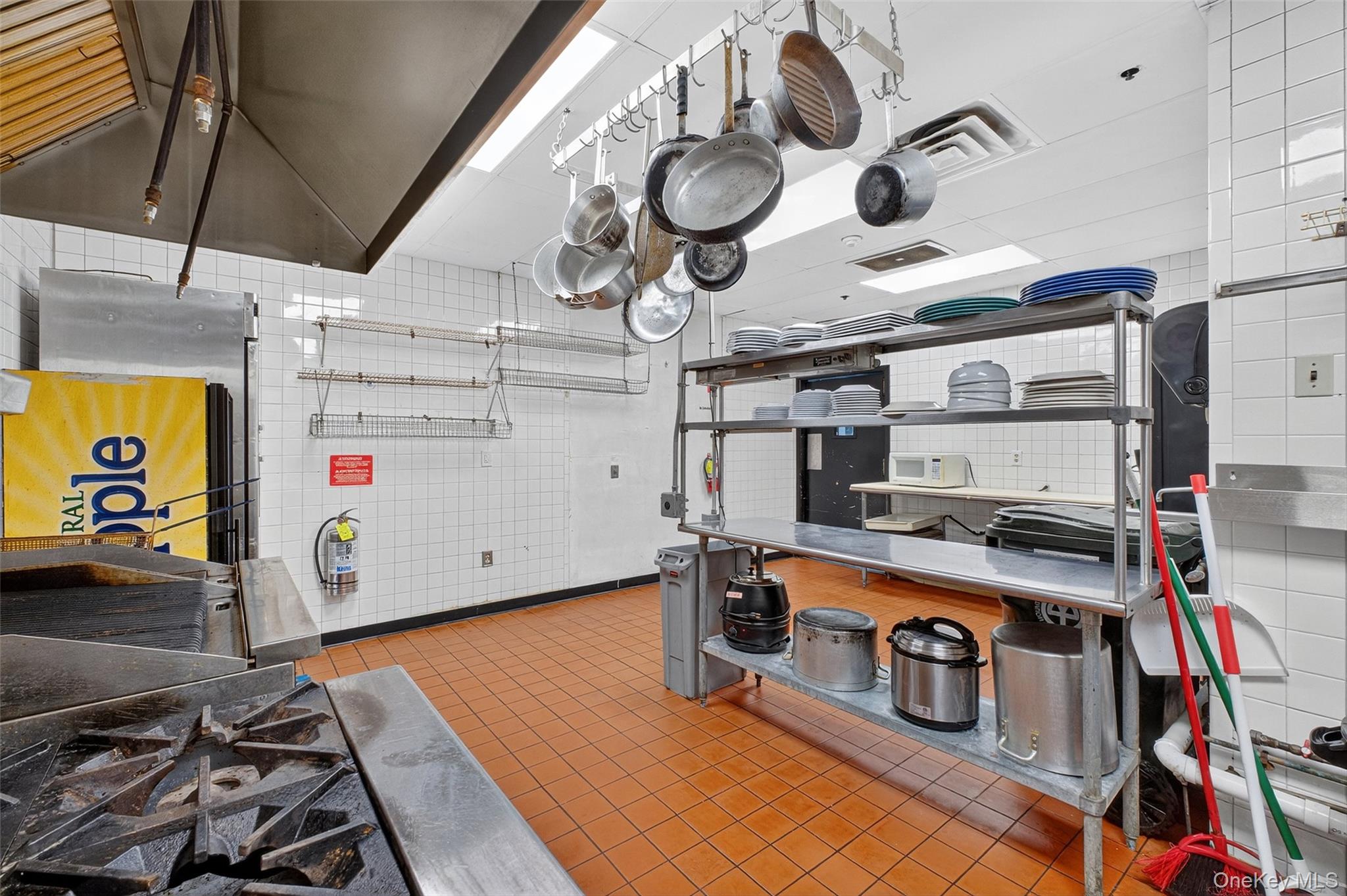 Kitchen with tile walls