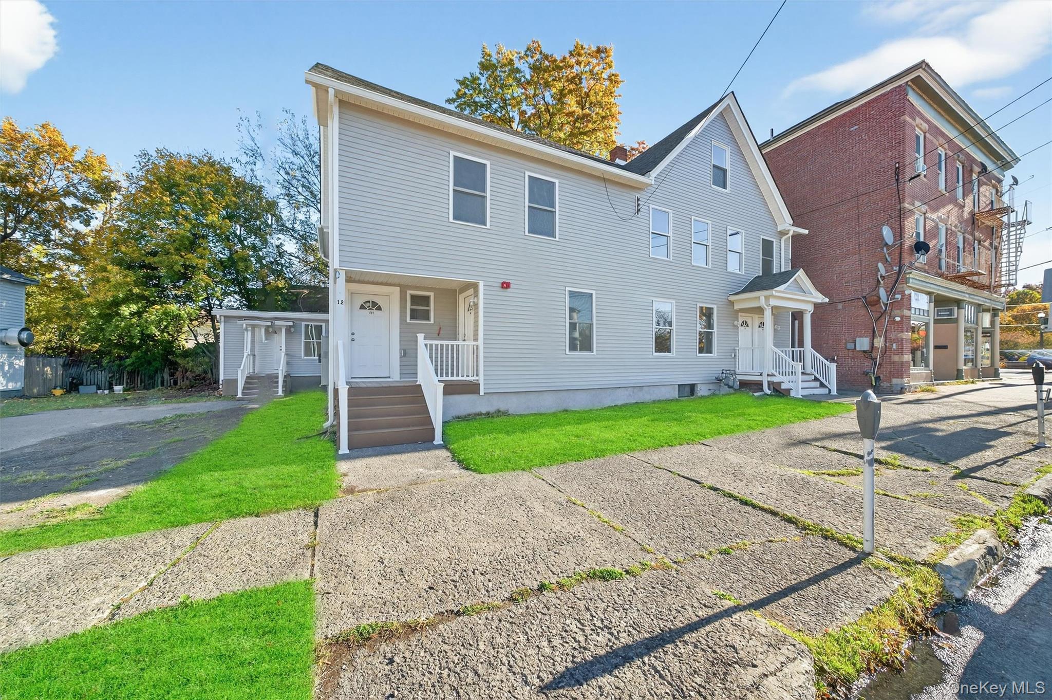 View of front of property with a front yard