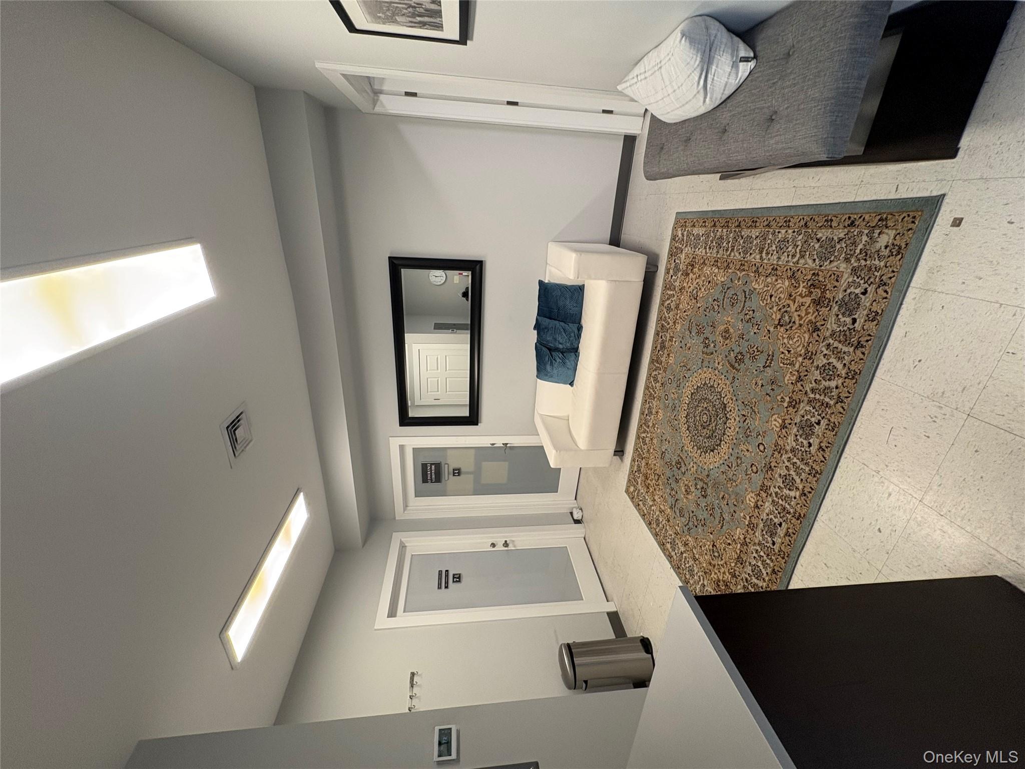 Living area featuring baseboards