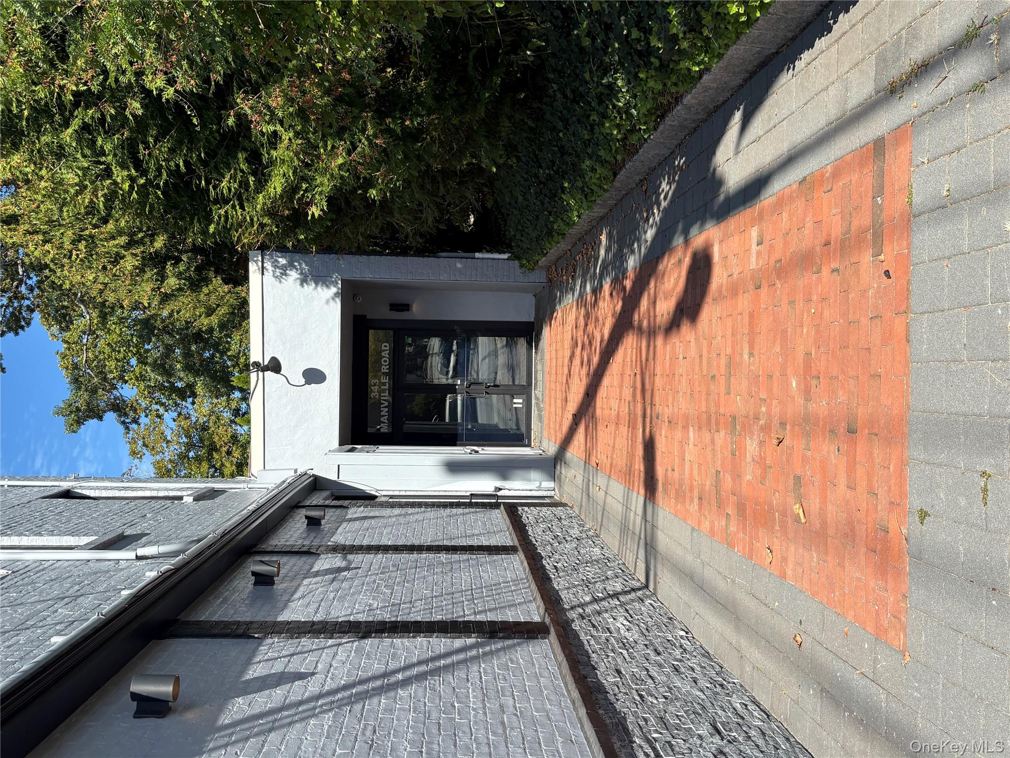 Front door of retail in back (gym)