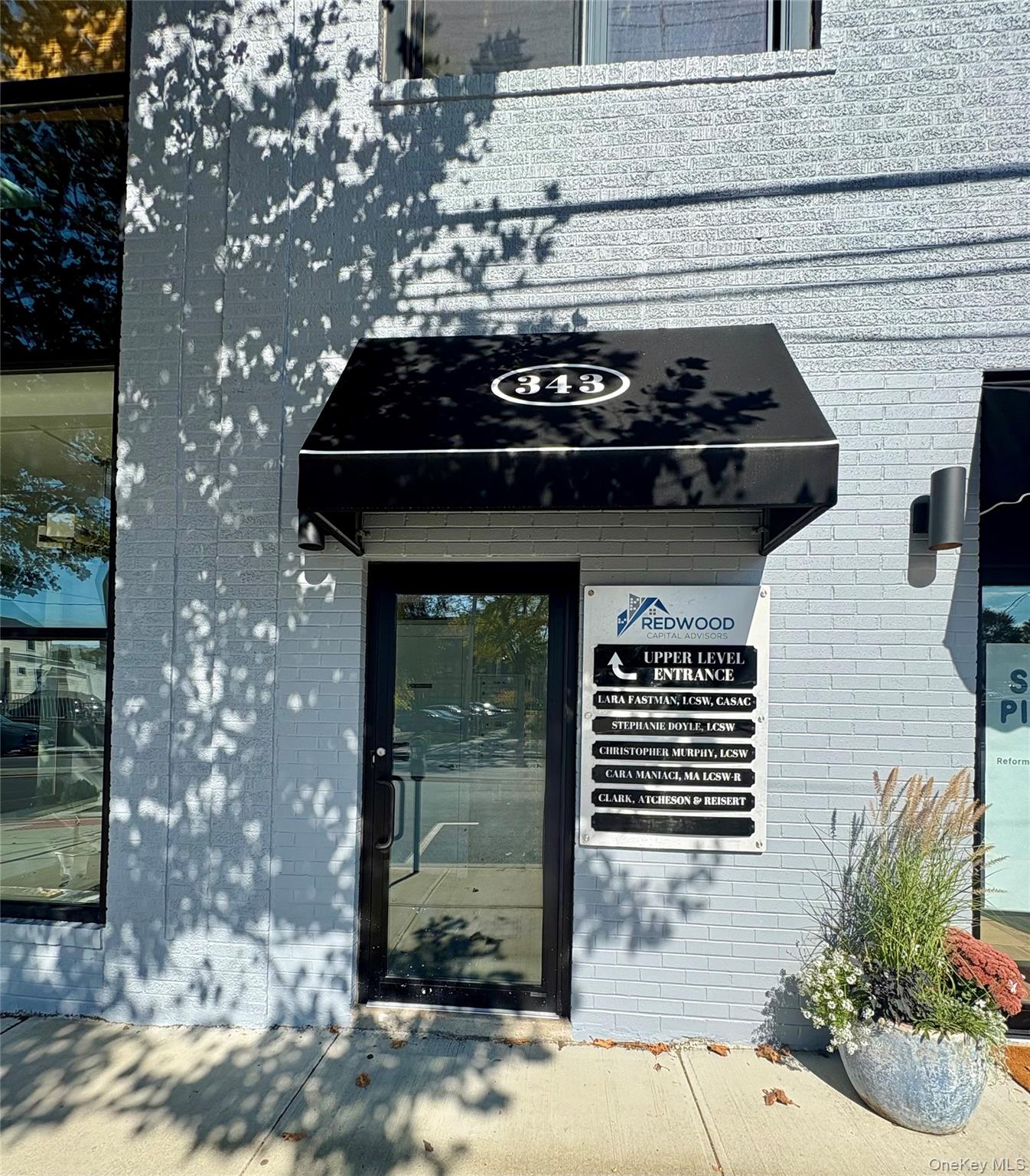 Doorway to property with brick siding