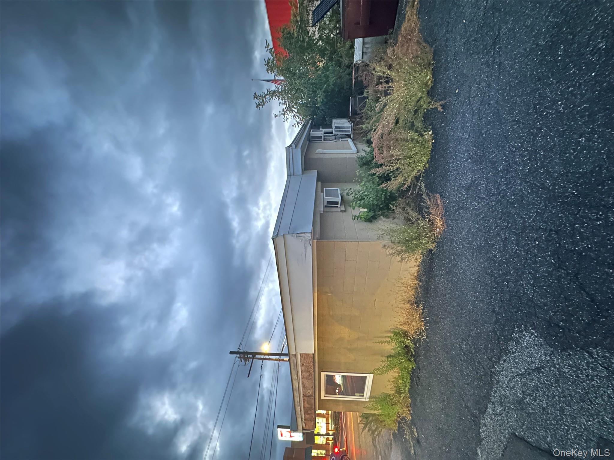 View of home's exterior featuring concrete block siding