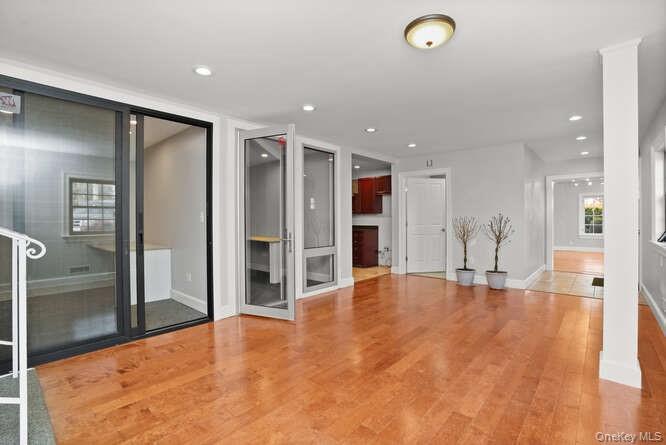 Unfurnished living room featuring light wood-style floors and recessed lighting