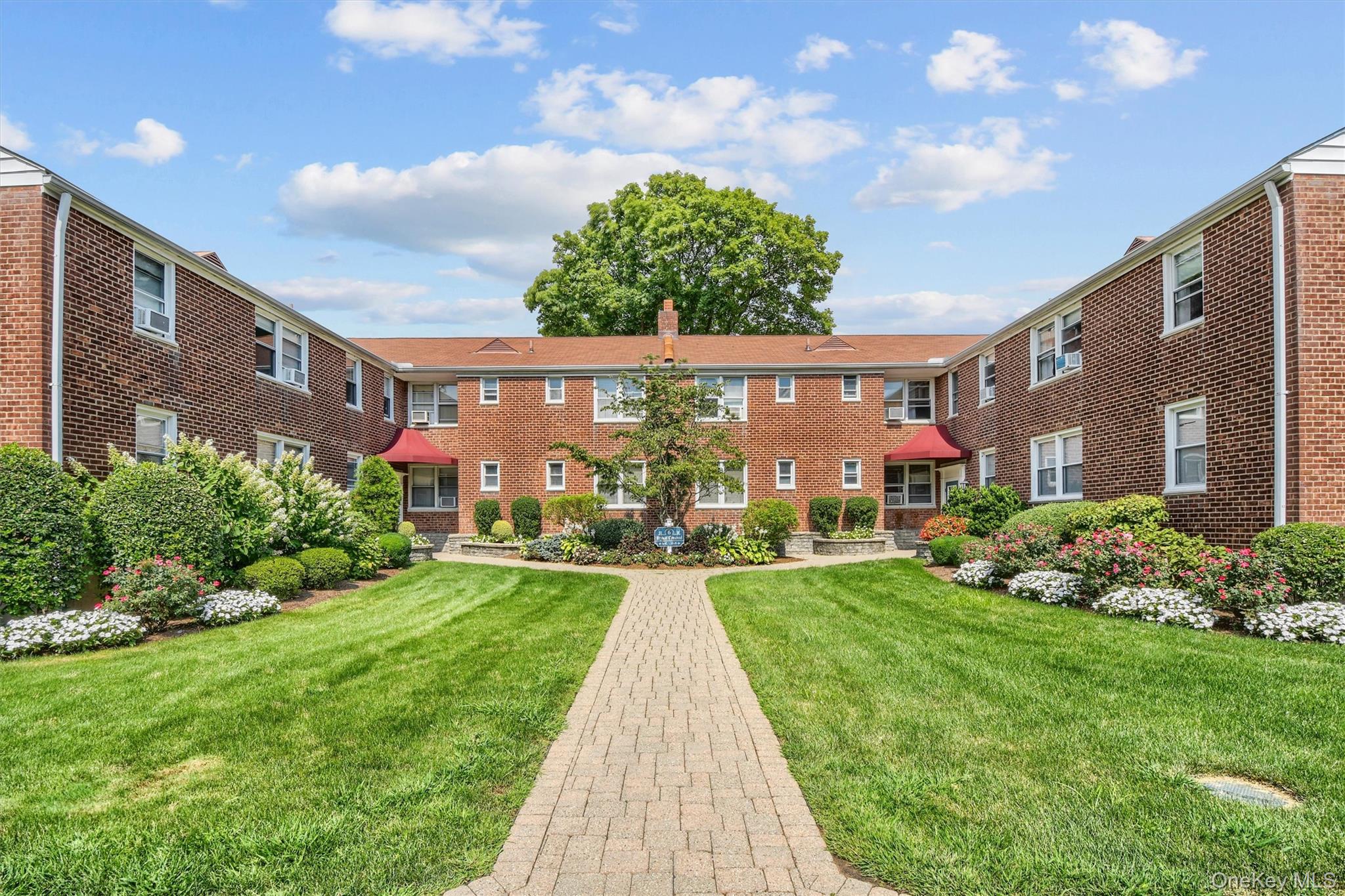 View of property's community with a yard