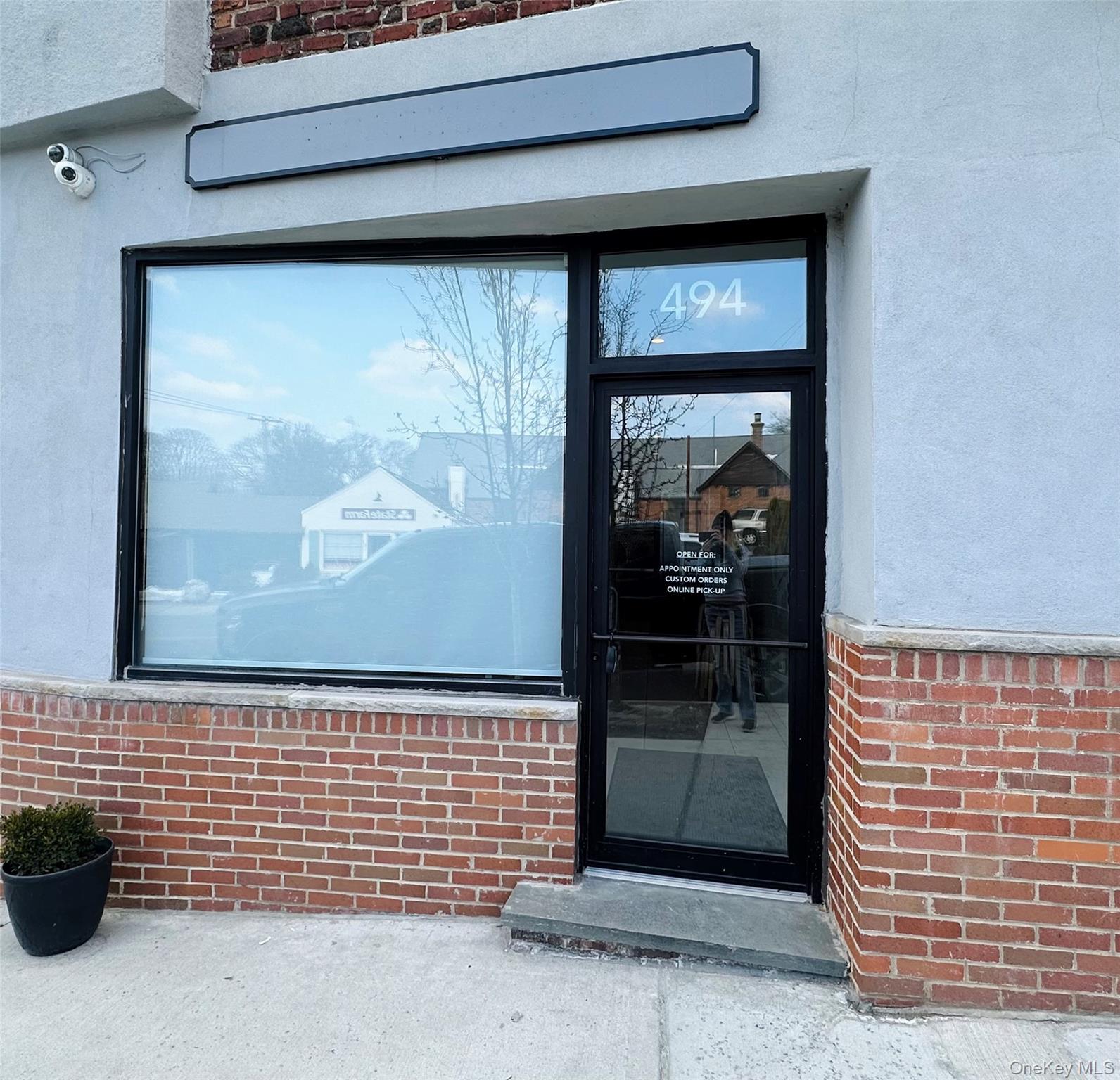 Entrance to property with brick and stucco siding.
