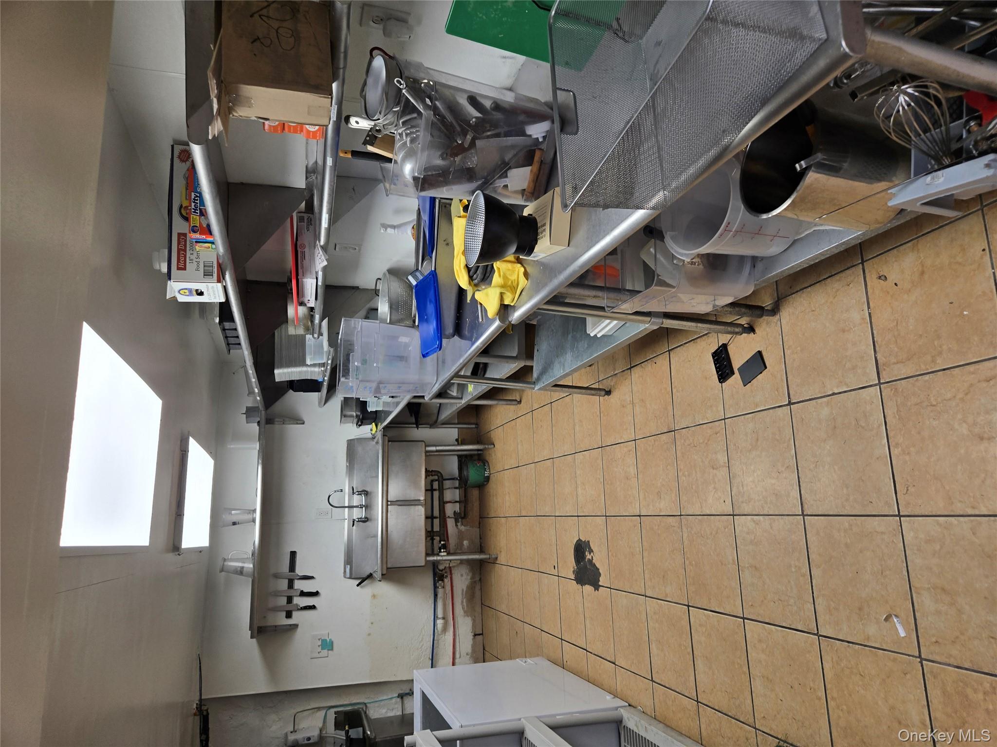 Kitchen featuring a skylight and washer / clothes dryer