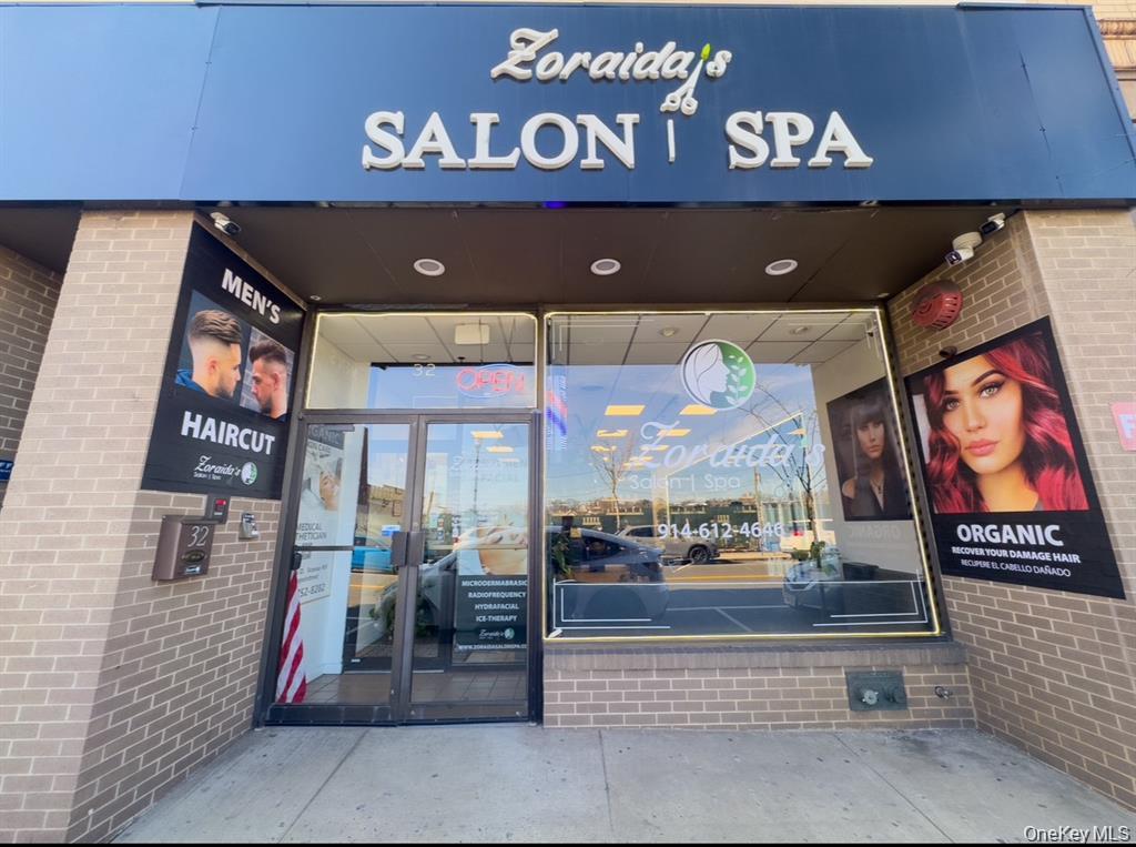 Property entrance featuring brick siding
