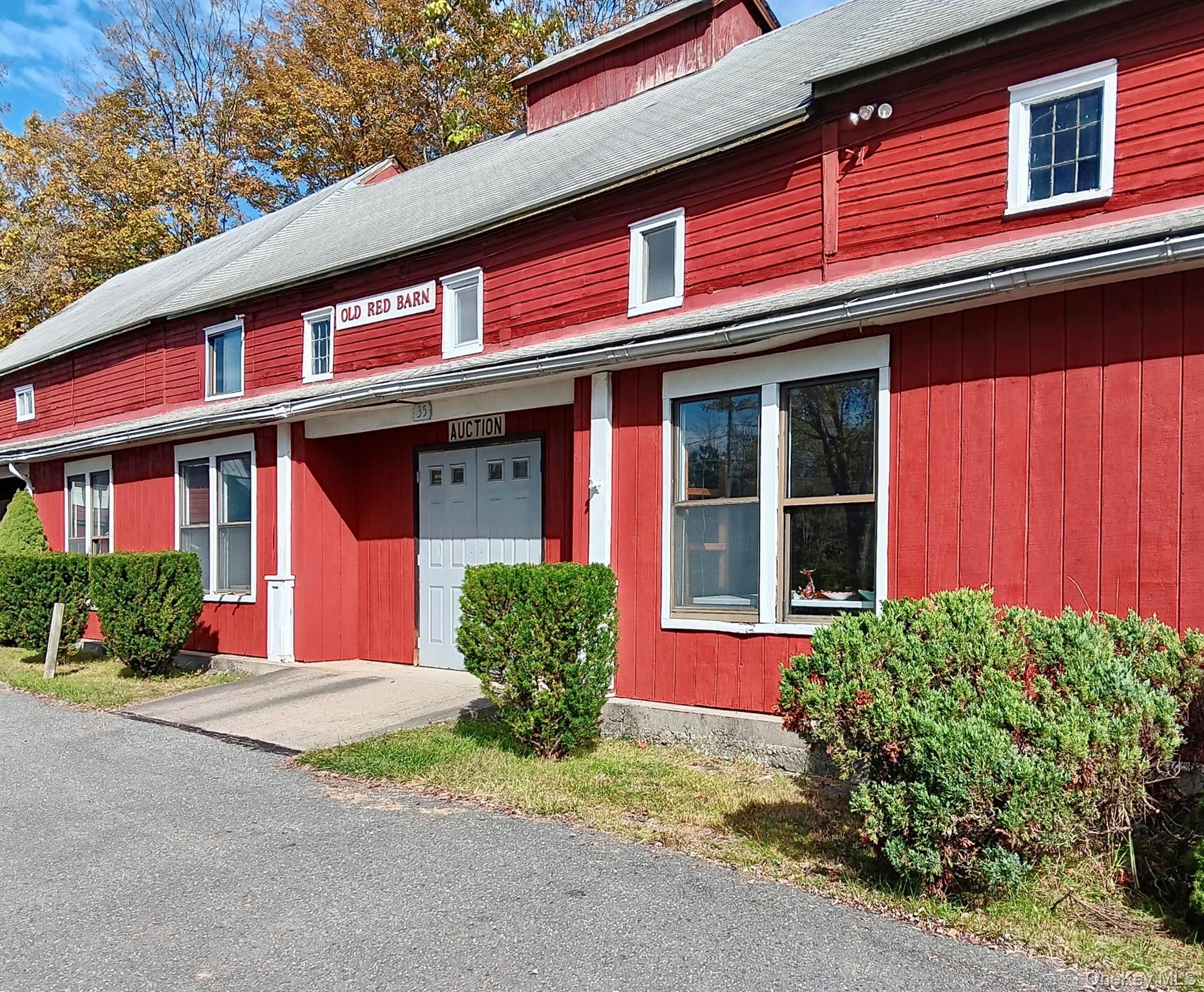 View of front of property featuring a shingled roof