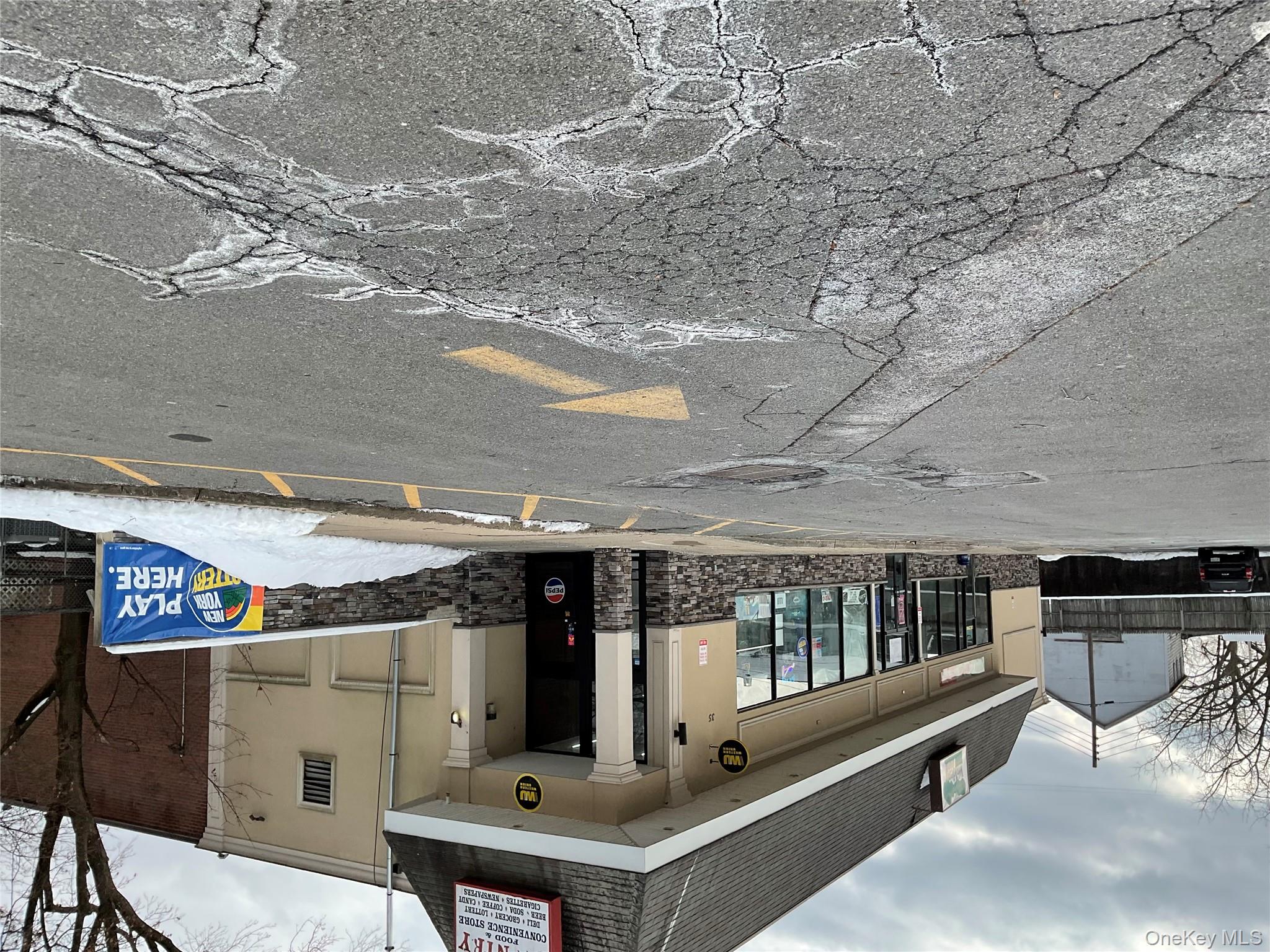 View of property with uncovered parking