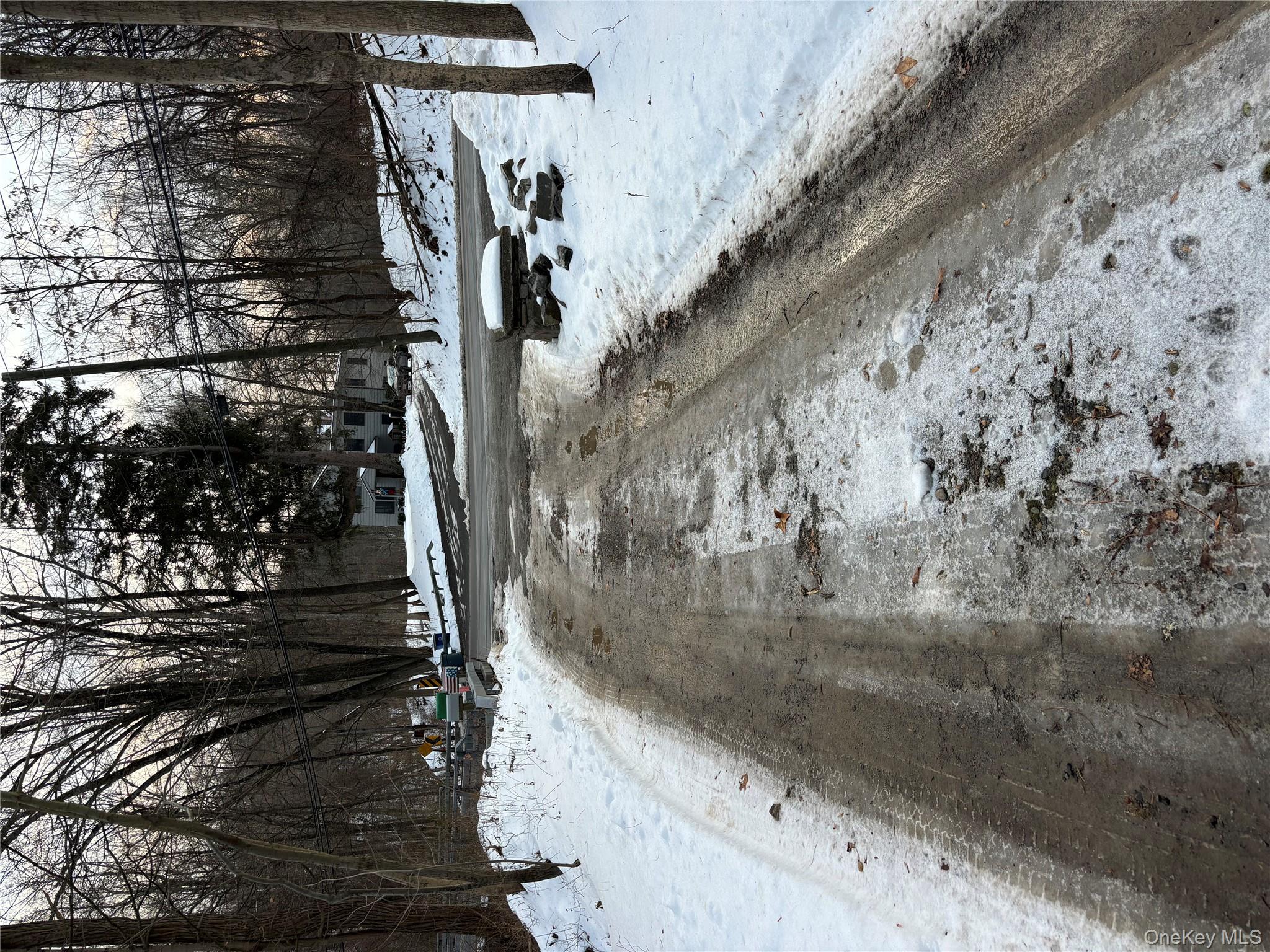 View of street with view of scattered trees