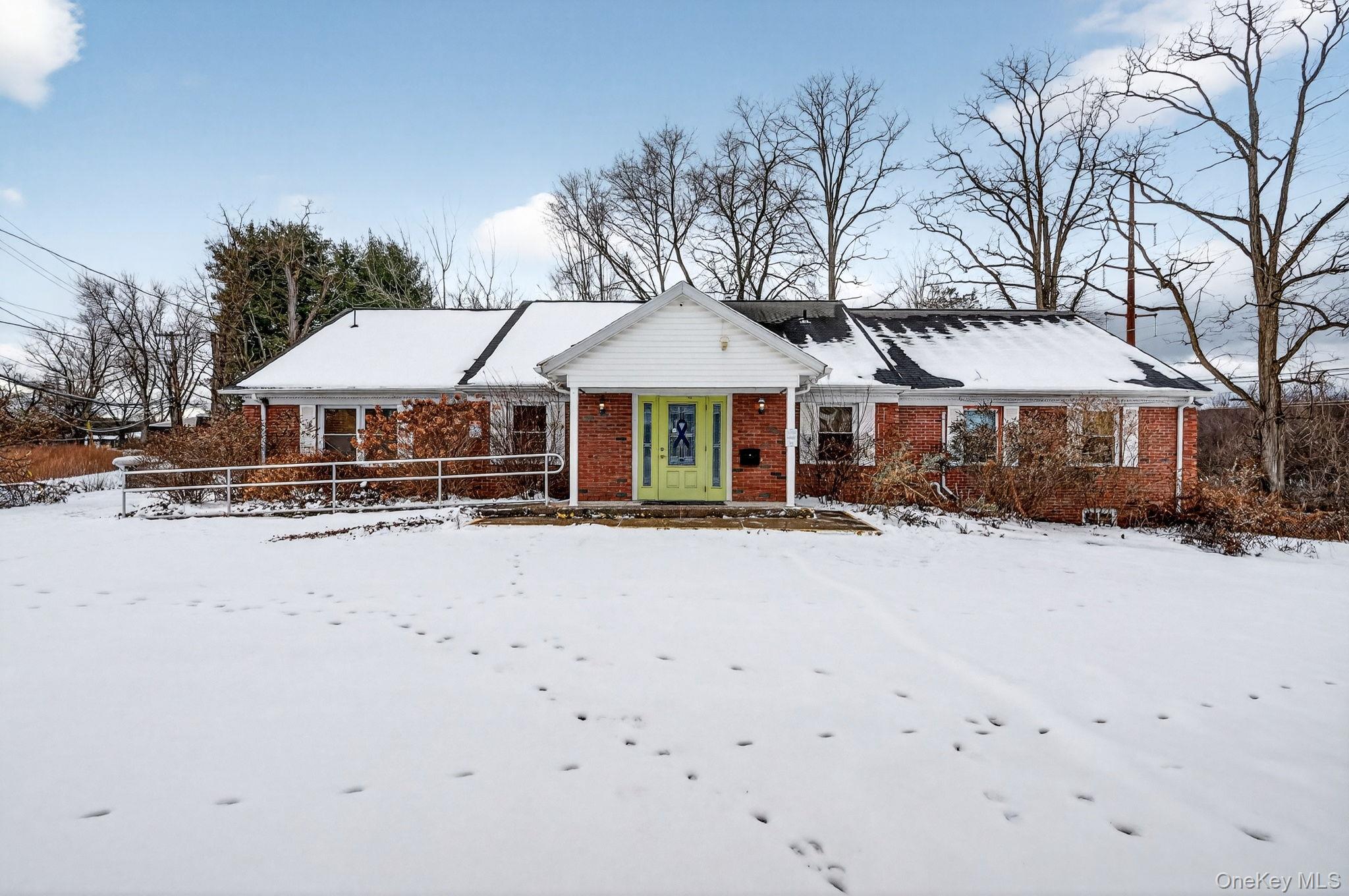 View of front of house with brick siding