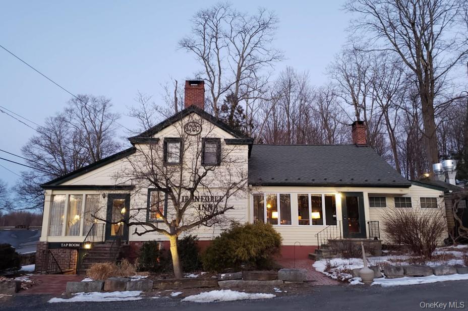 View of front of property with a chimney