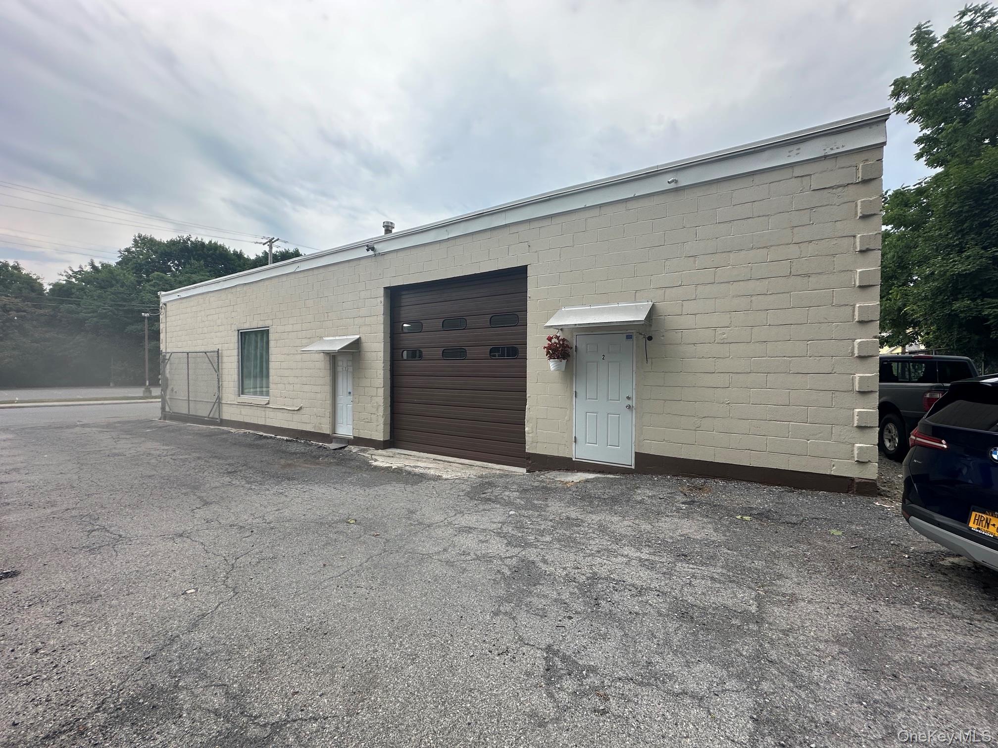 Entrance -Pull into a large wrap around parking area that is fully gated and secure. Inside this building is quite large with lots of space and high ceilings. Well insulated. Keep scrolling through the pictures.
