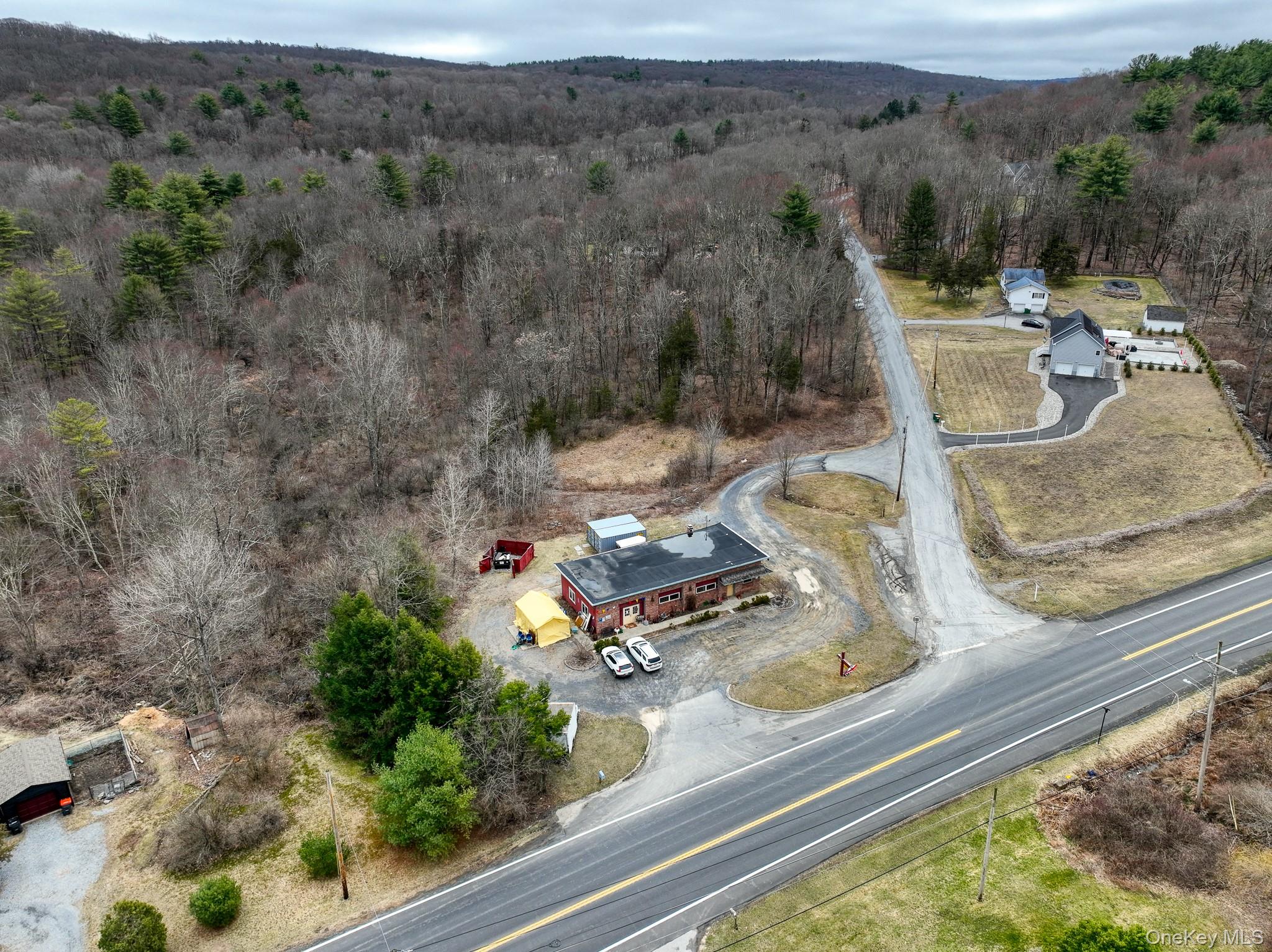 View of property location featuring a heavily wooded area