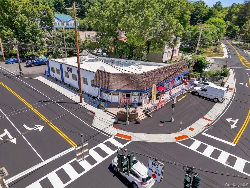 Turnkey town-center commercial property featuring maximum signage exposure, excellent foot traffic, and rare dedicated parking.