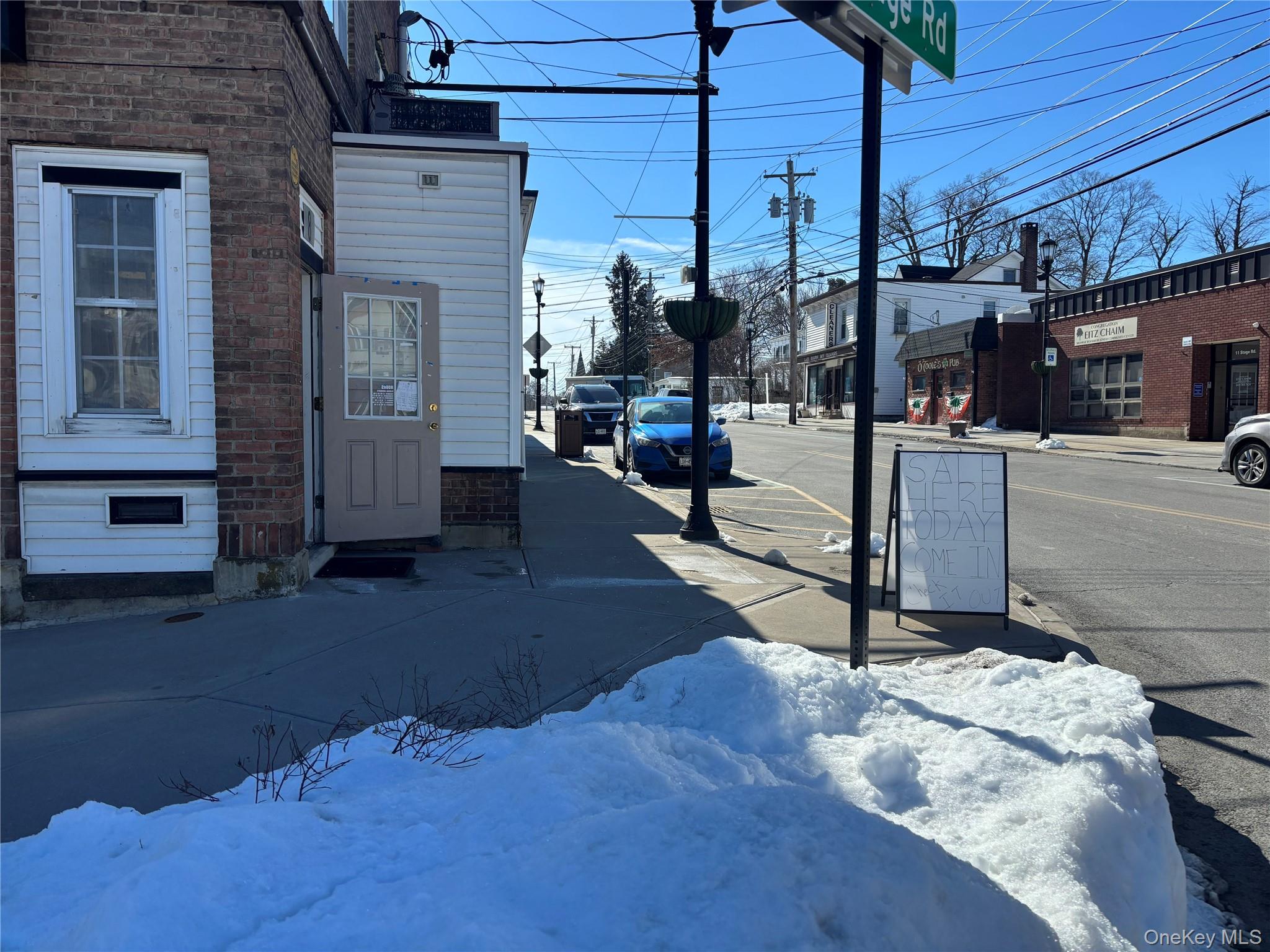 Street view showing retail store on first level.