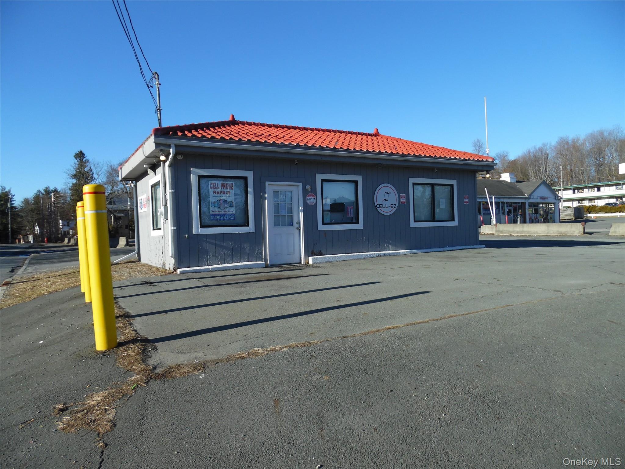View of front of property featuring a tile roof