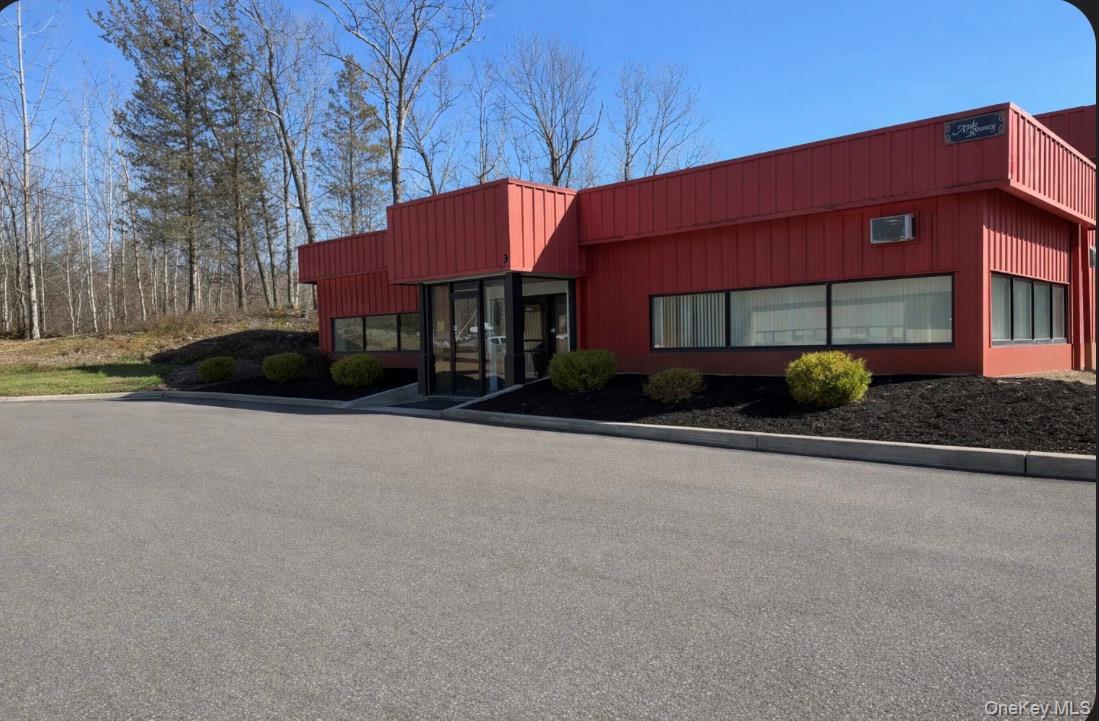 Beautiful commercial building ideally situated just off Route 9W, offering excellent visibility and easy access for both customers and commuters. This well-maintained property features a spacious interior with approximately  of 1306 of versatile space, pe