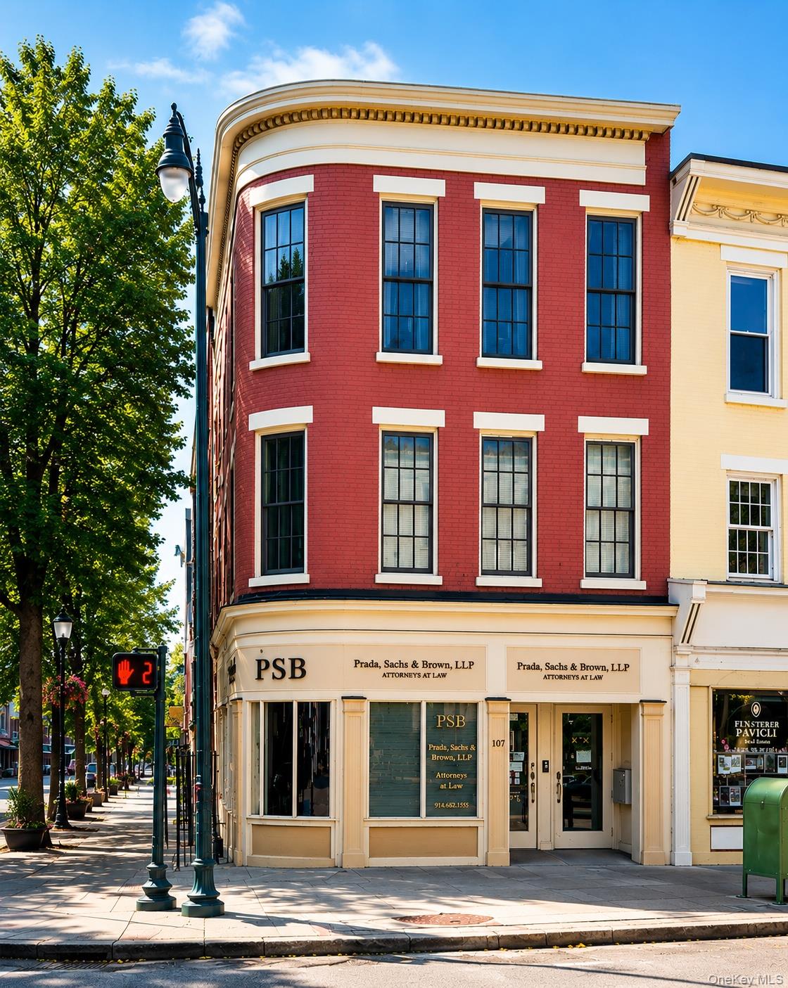 Historic corner building with below storefront.