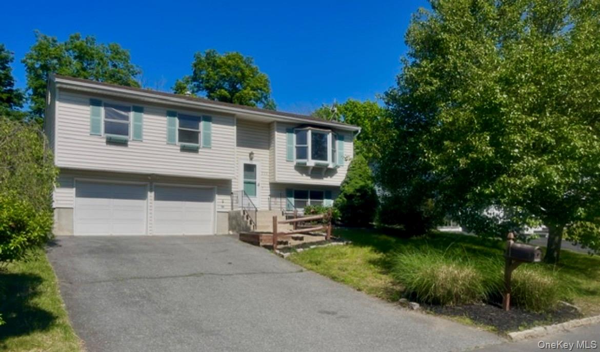 Lovely high ranch with 2 car garage