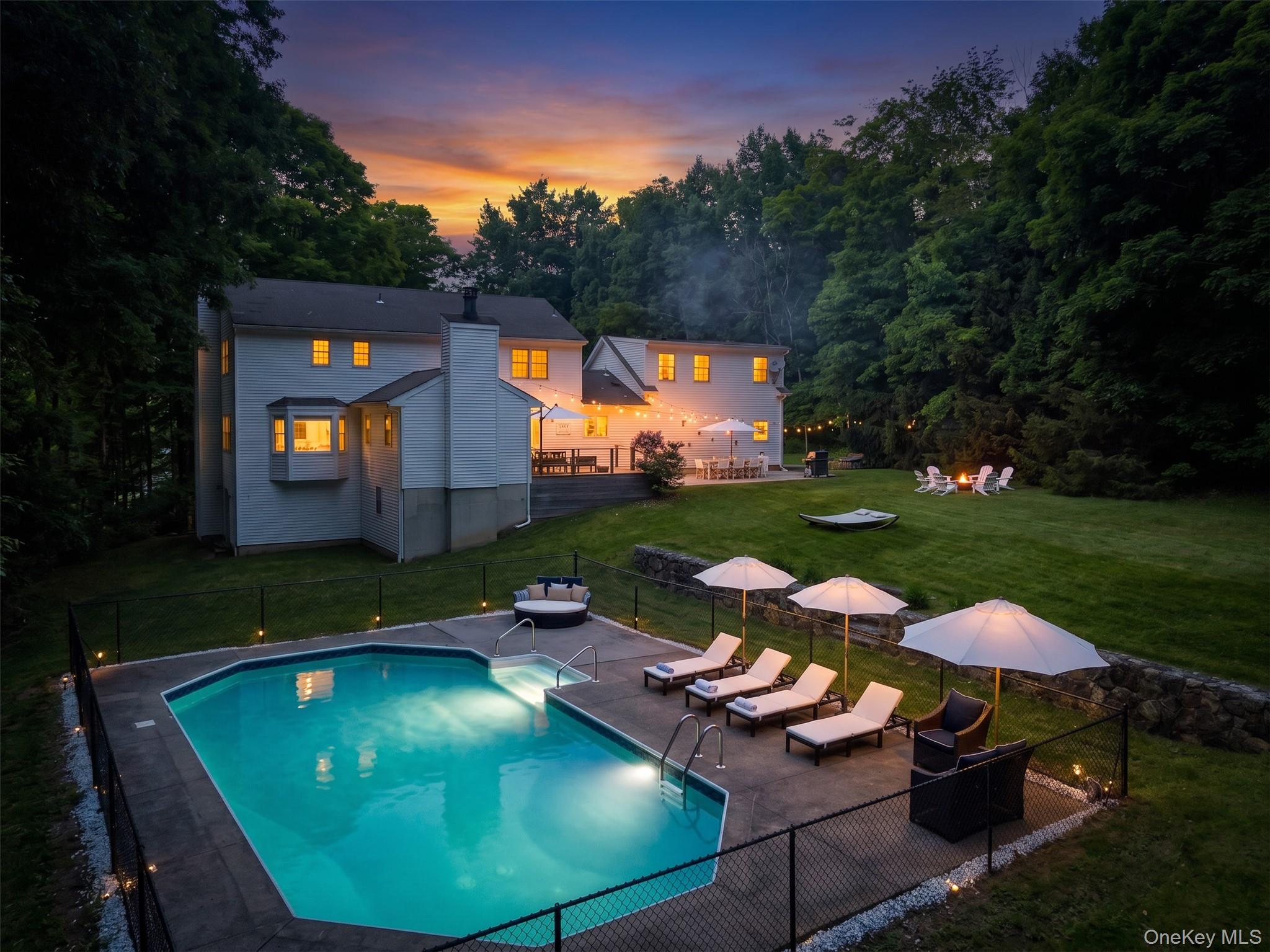 Stunning backyard with pool and lots of entertaining spaces.