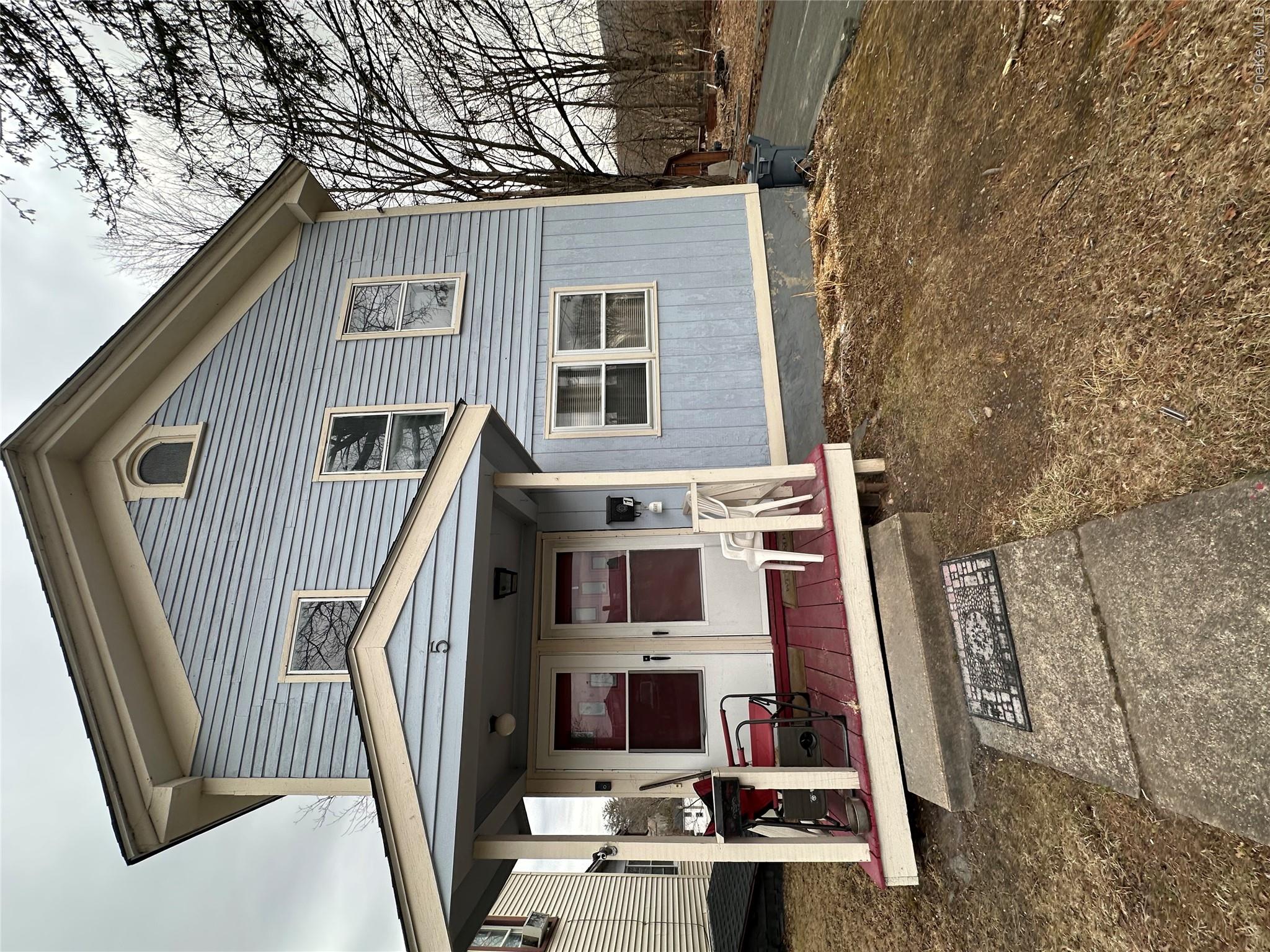View of front of house featuring a porch and board and batten siding