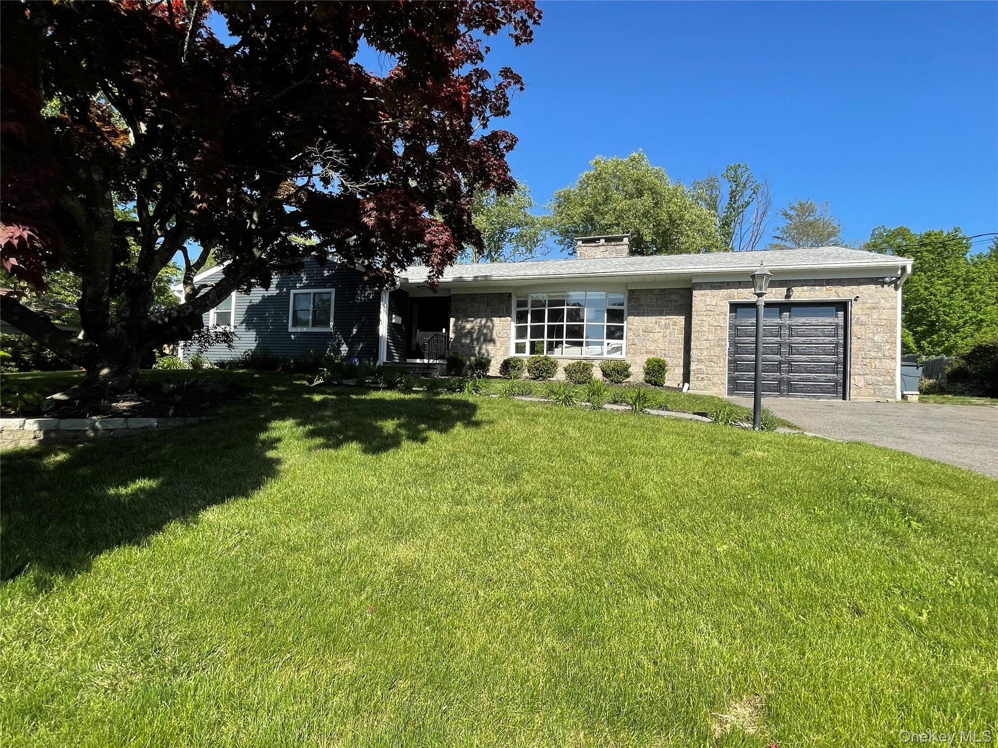 Front of home with new garage door