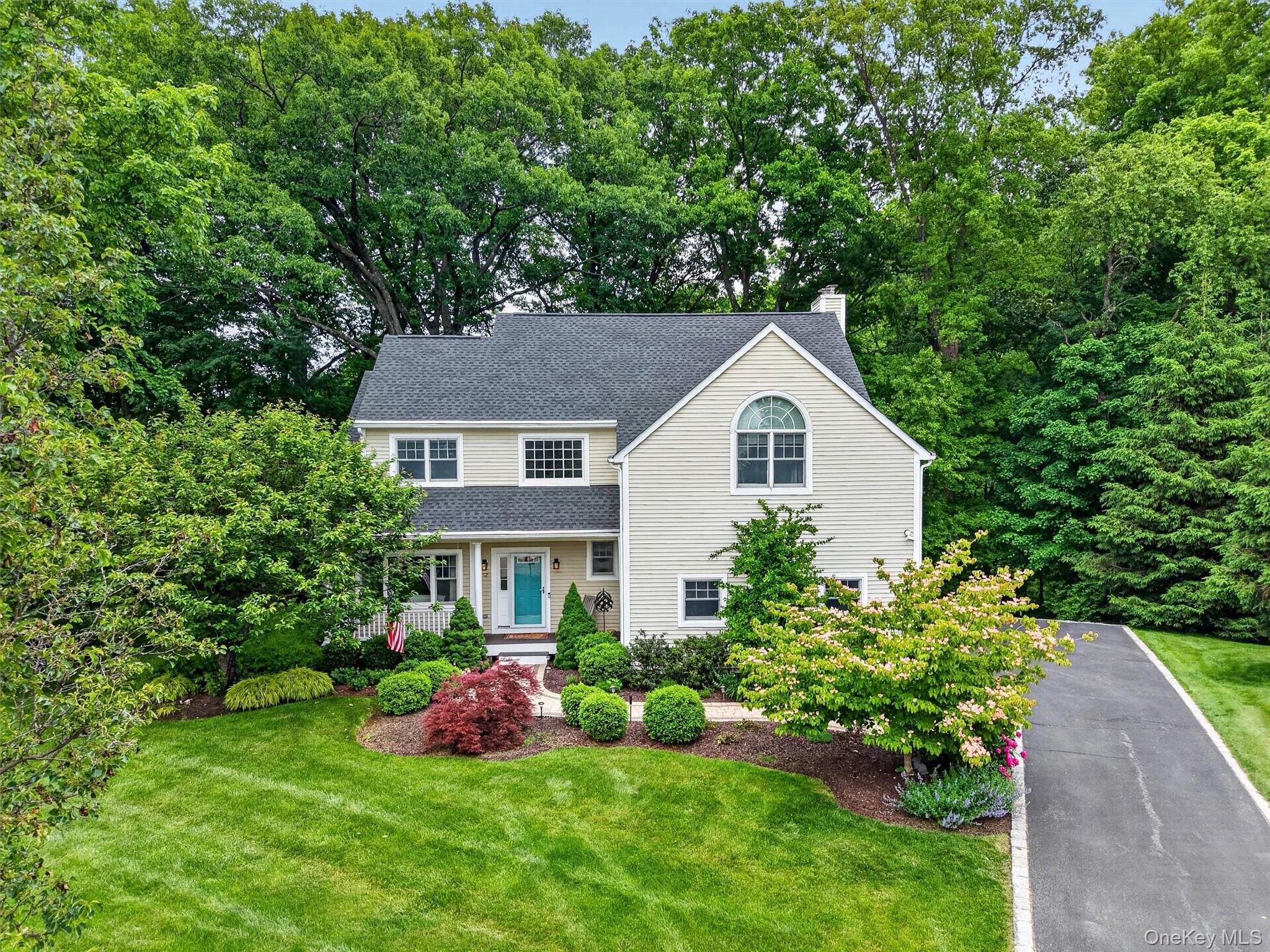 Beautifully landscaped Colonial set on a private cul-de-sac in desirable Croton-on-Hudson.
