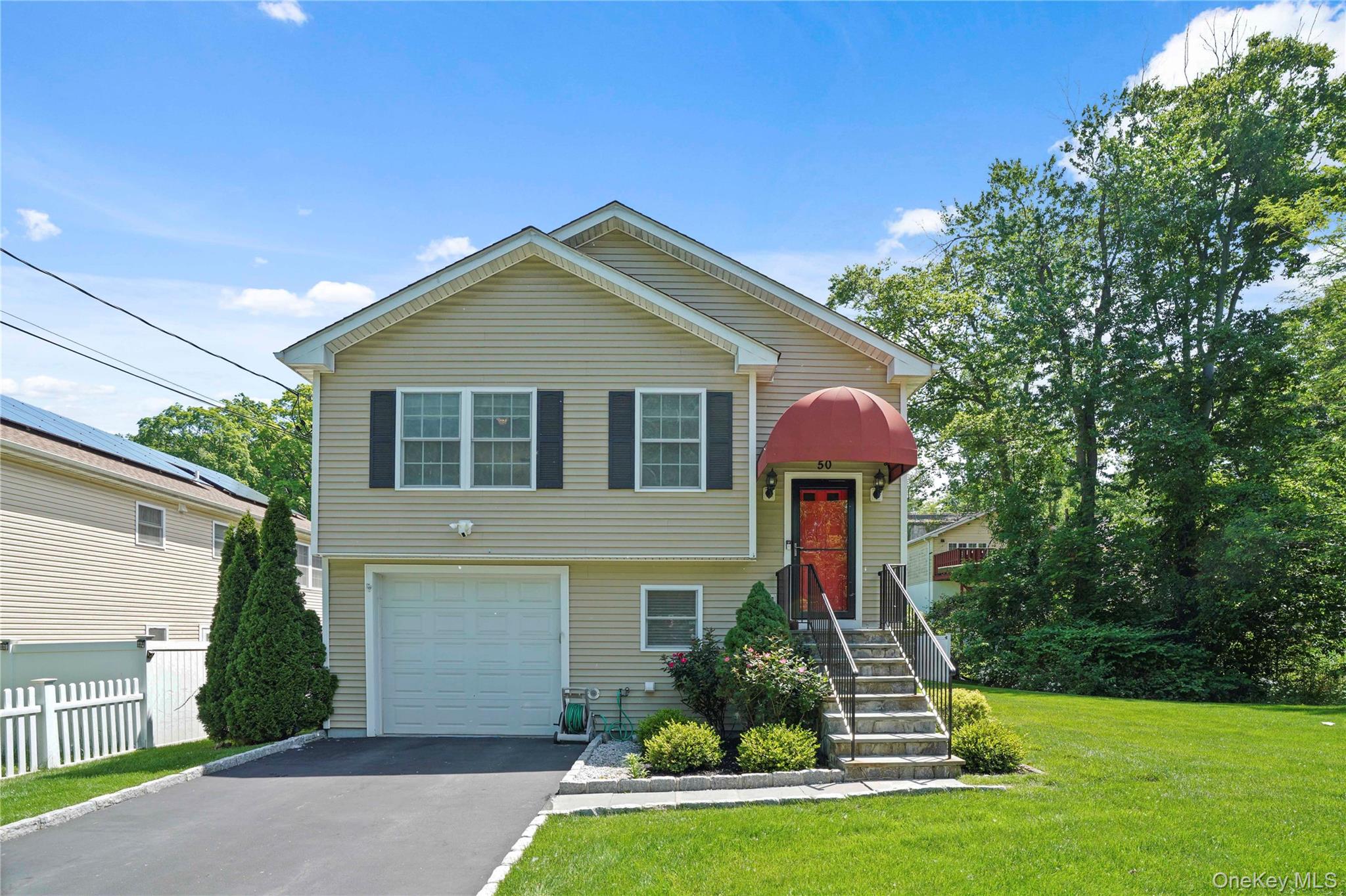 Lovely home on corner lot with manicured grounds.