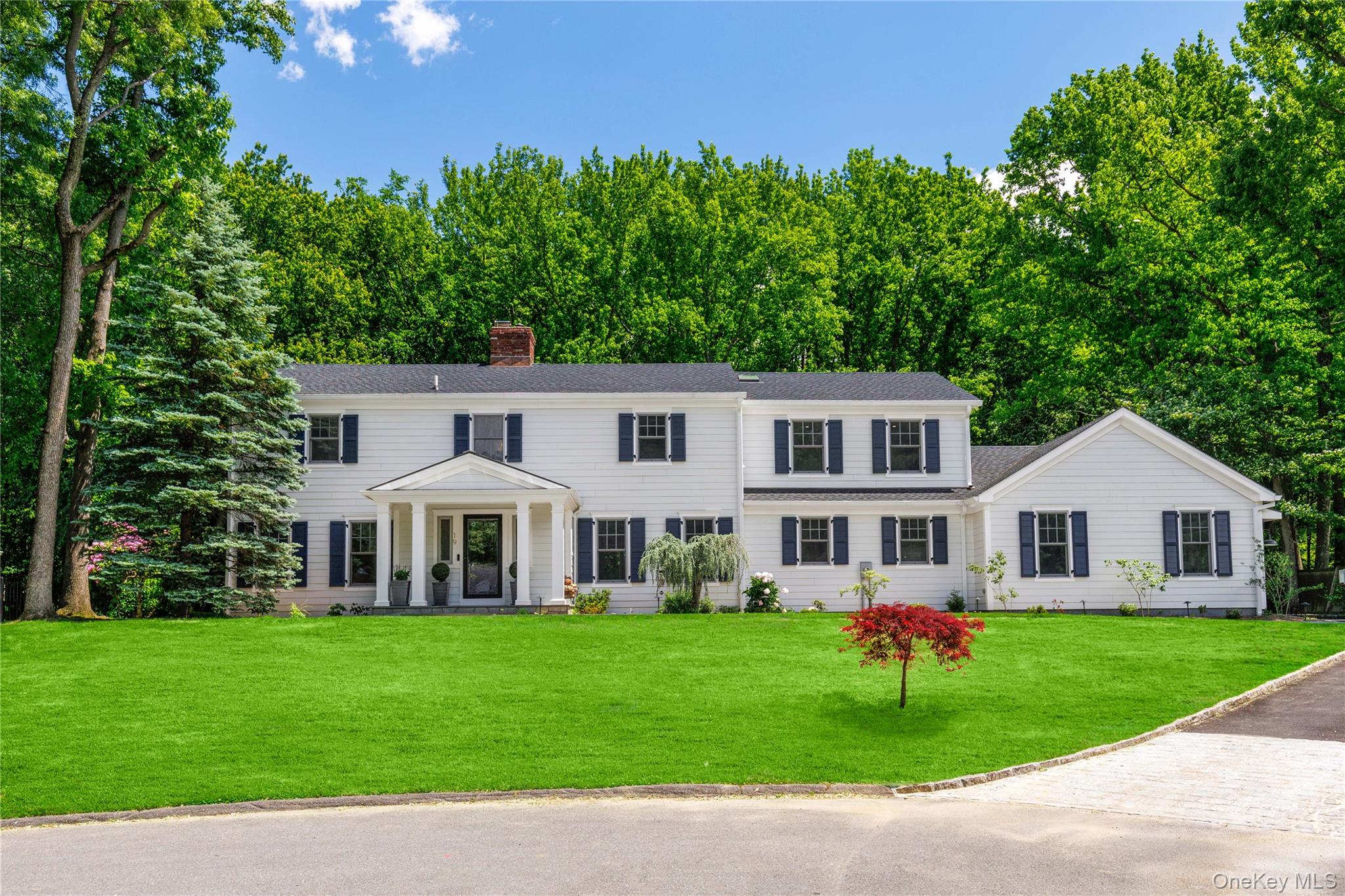 The stately Colonial architecture blends classic lines with eye-catching curb appeal.