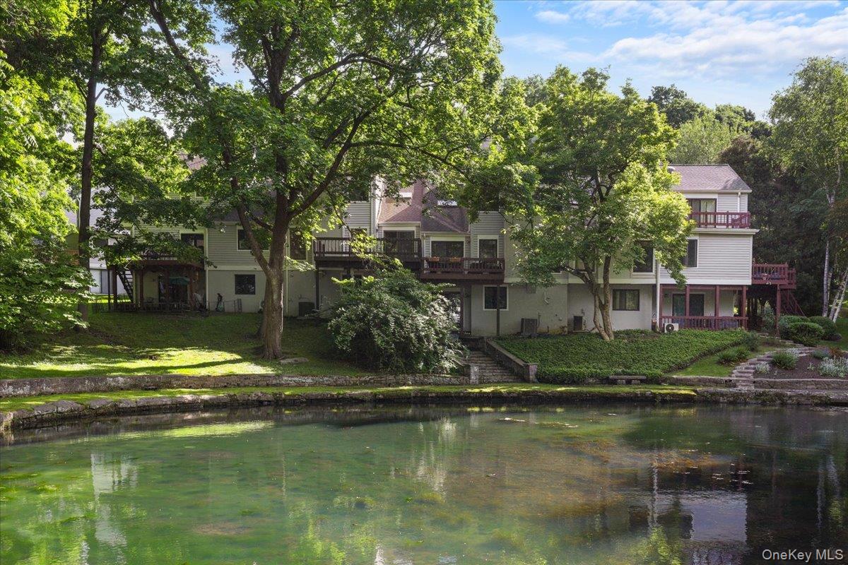 Beautifully maintained community pond and garden setting.
