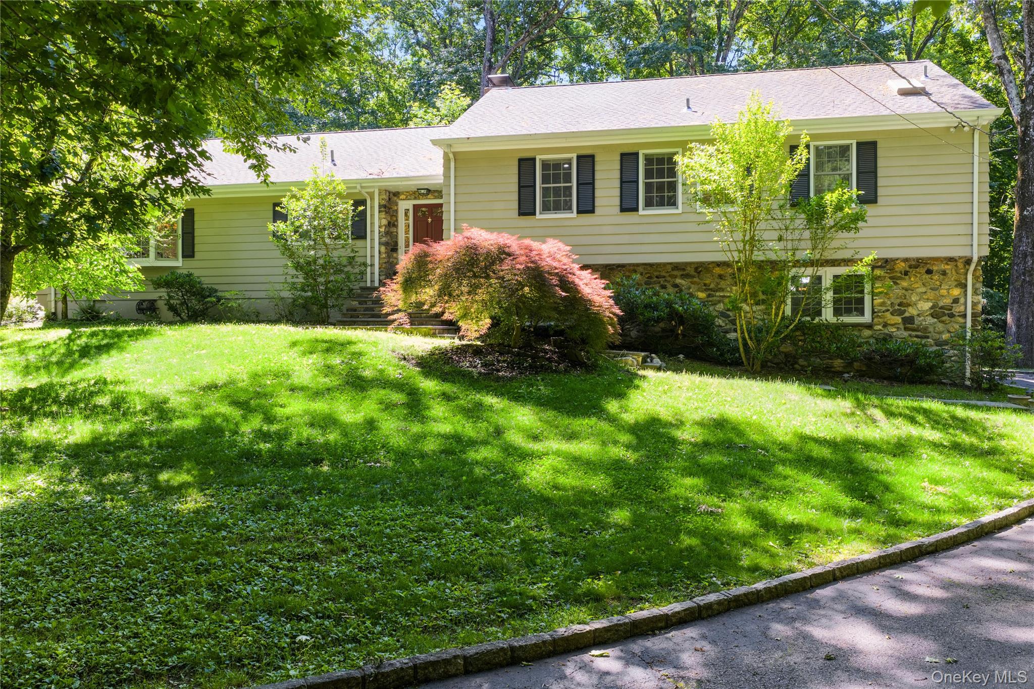 Welcome to 105 Cross Ridge Rd, walkable to Chappaqua train and village center, this renovated split ranch style home with expansive rear slate patios offers both privacy and a neighborhood setting. This 4 bedroom, 2 full bath and 2 powder room home offers
