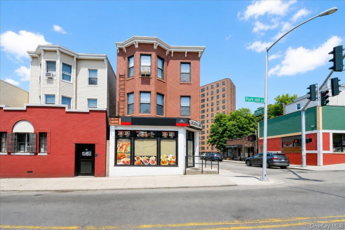 Brick commercial building with a ground-floor storefront