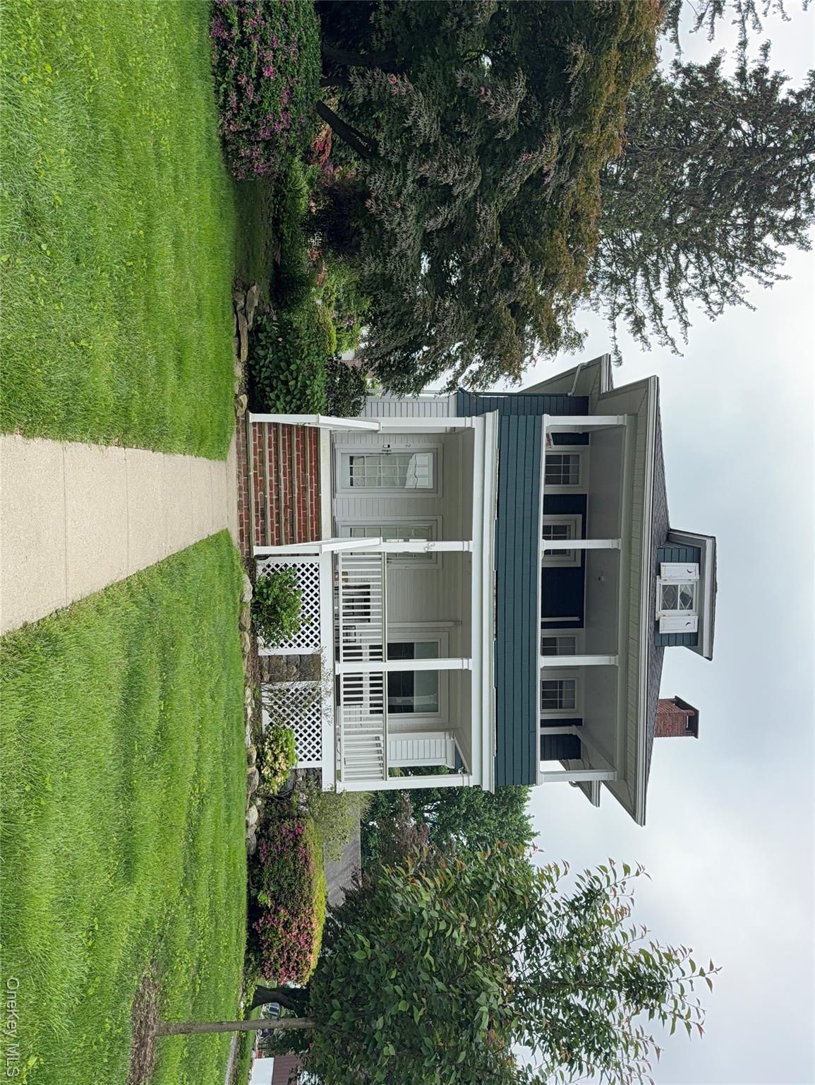 American foursquare style home with covered front porch