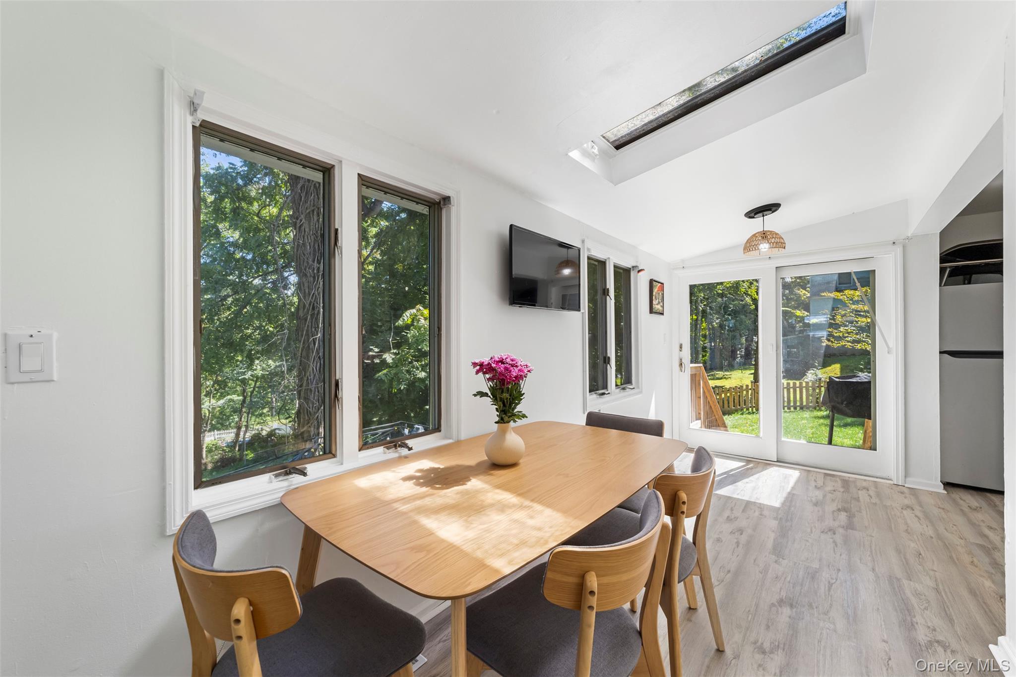 Dining area off the kitchen with sliding doors out to fenced in backyard