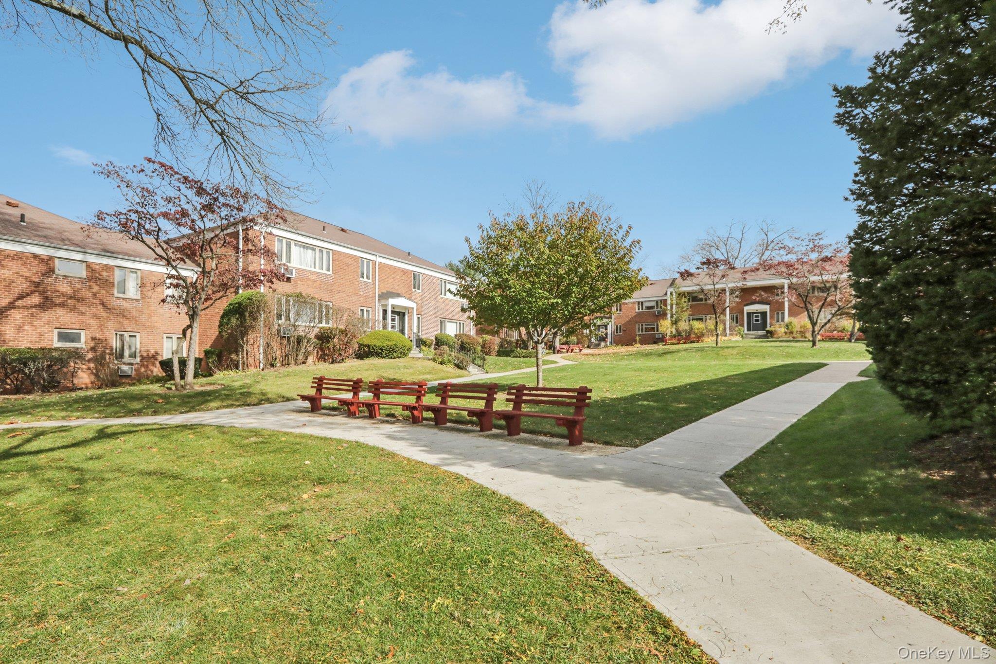 View of property's community featuring a lawn