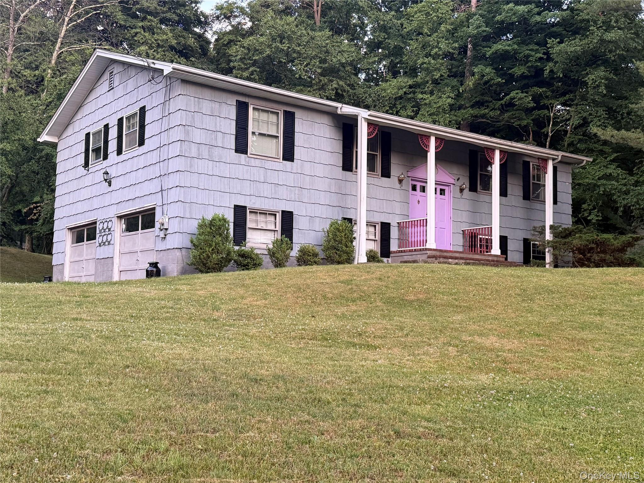 front of home.  Entry to apartment is on the other side