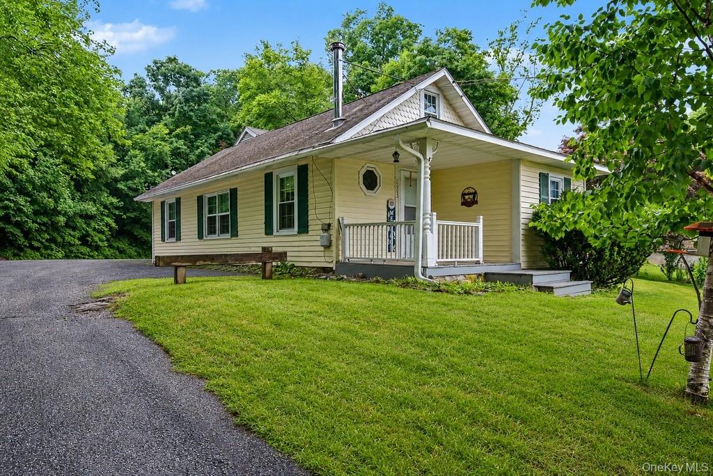 Welcoming covered front porch greets you at 1352 Route 6!