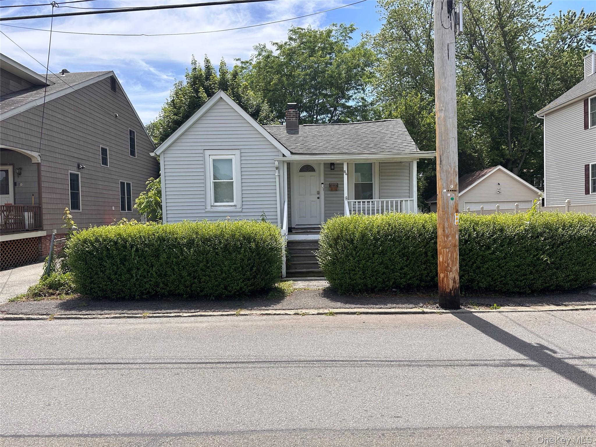 Front of house with covered porch