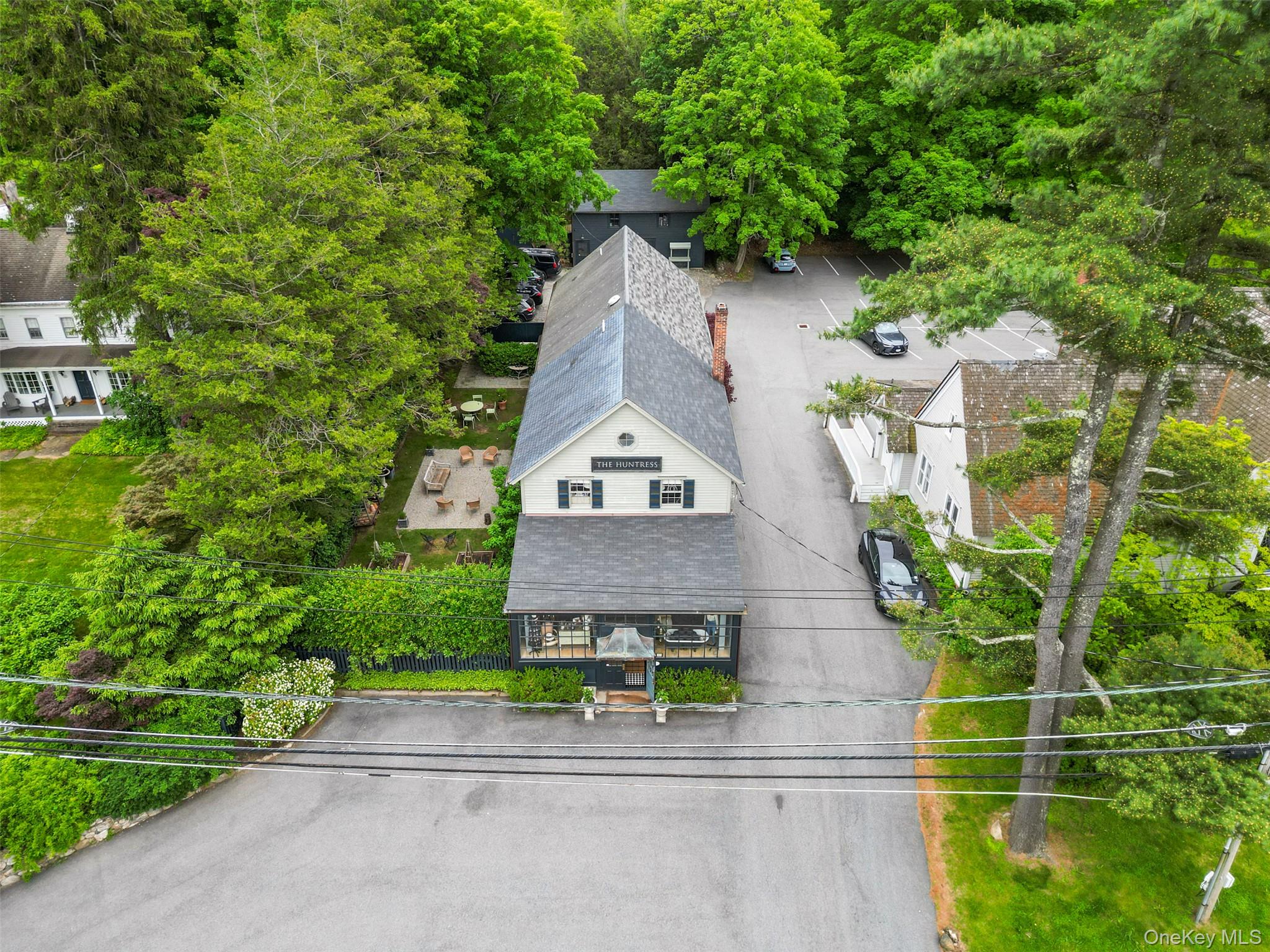 Aerial view of property and surrounding area. Apartment on second floor