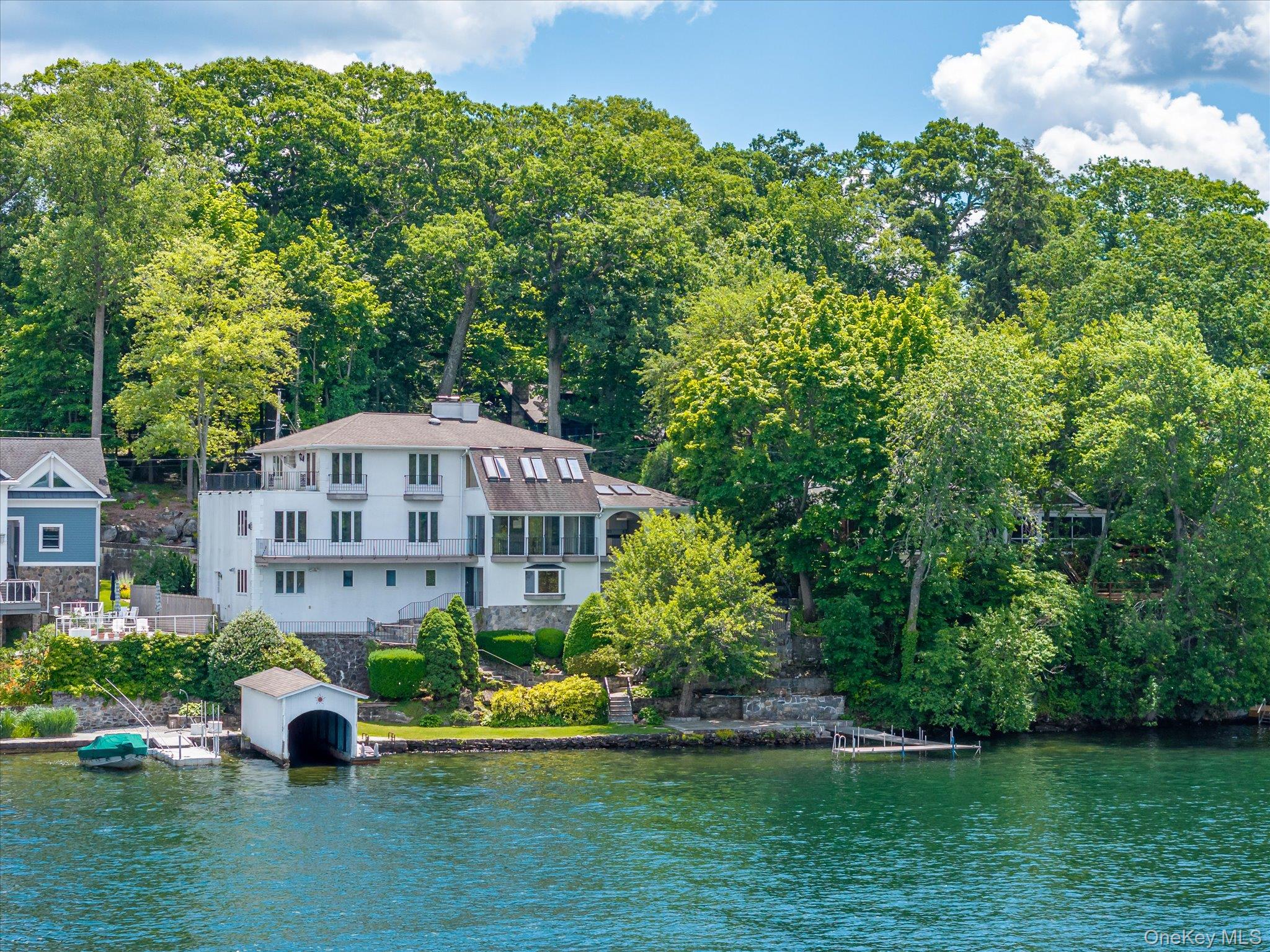 A private boathouse, a dock, and over 100 feet of open water on Lake Mahopac, offered for the first time in over 50 years