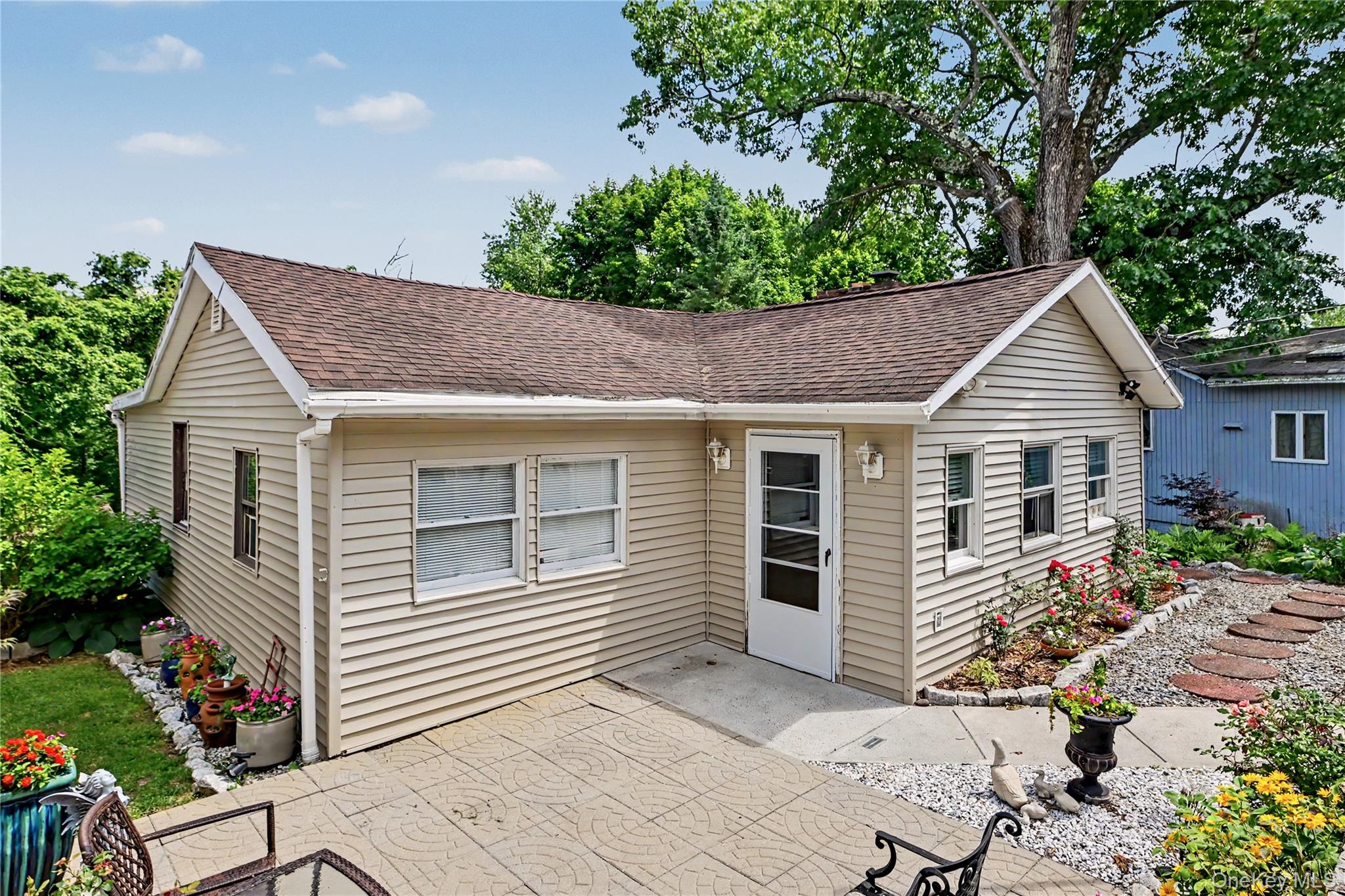 Charming ranch style home with beautiful gardens.
